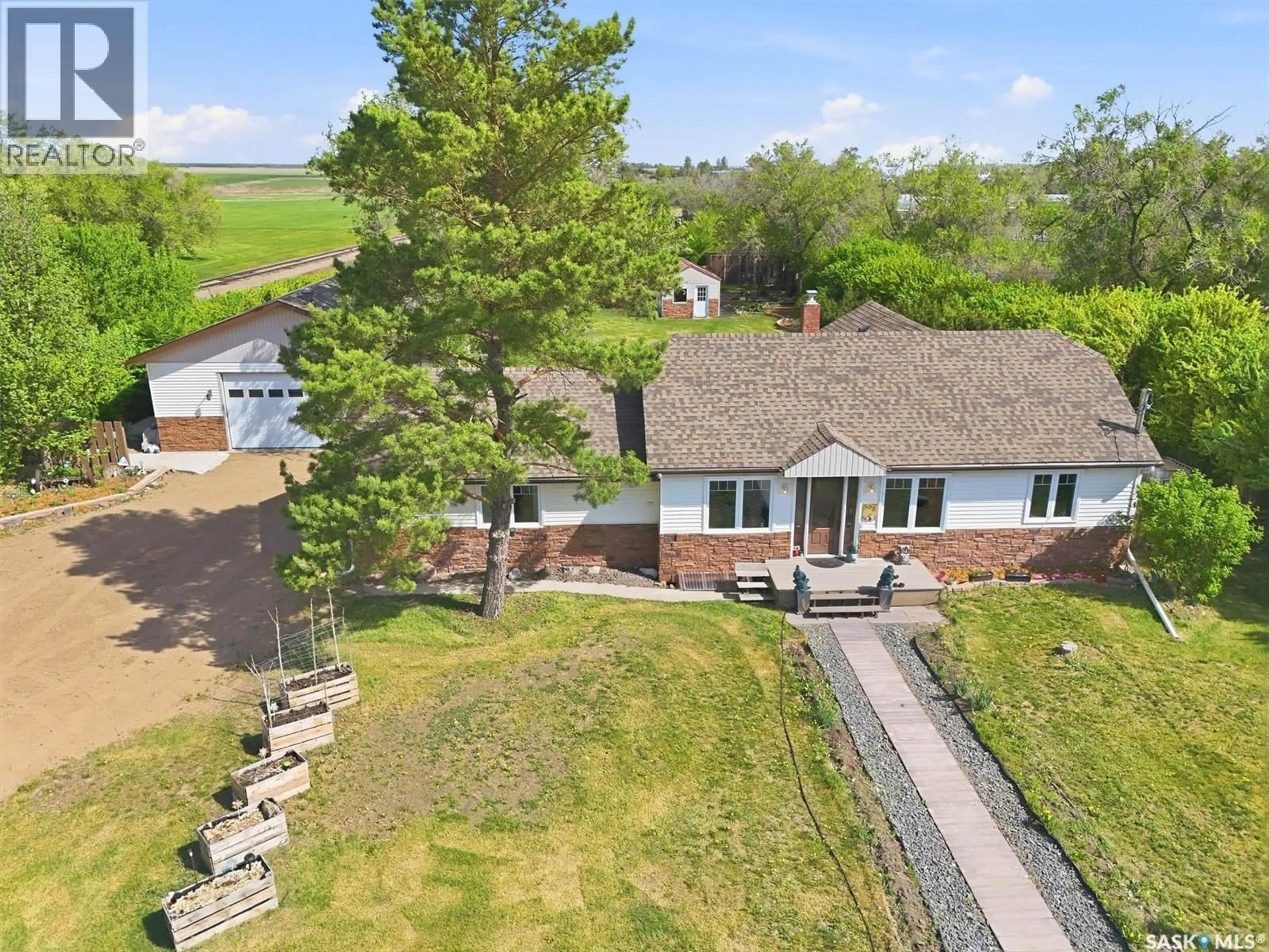 A pic from outside/outdoor area/front of a property/back of a property/a pic from drone, water/lake/river/ocean view for 503 3RD STREET, Dundurn Saskatchewan S0K1K0