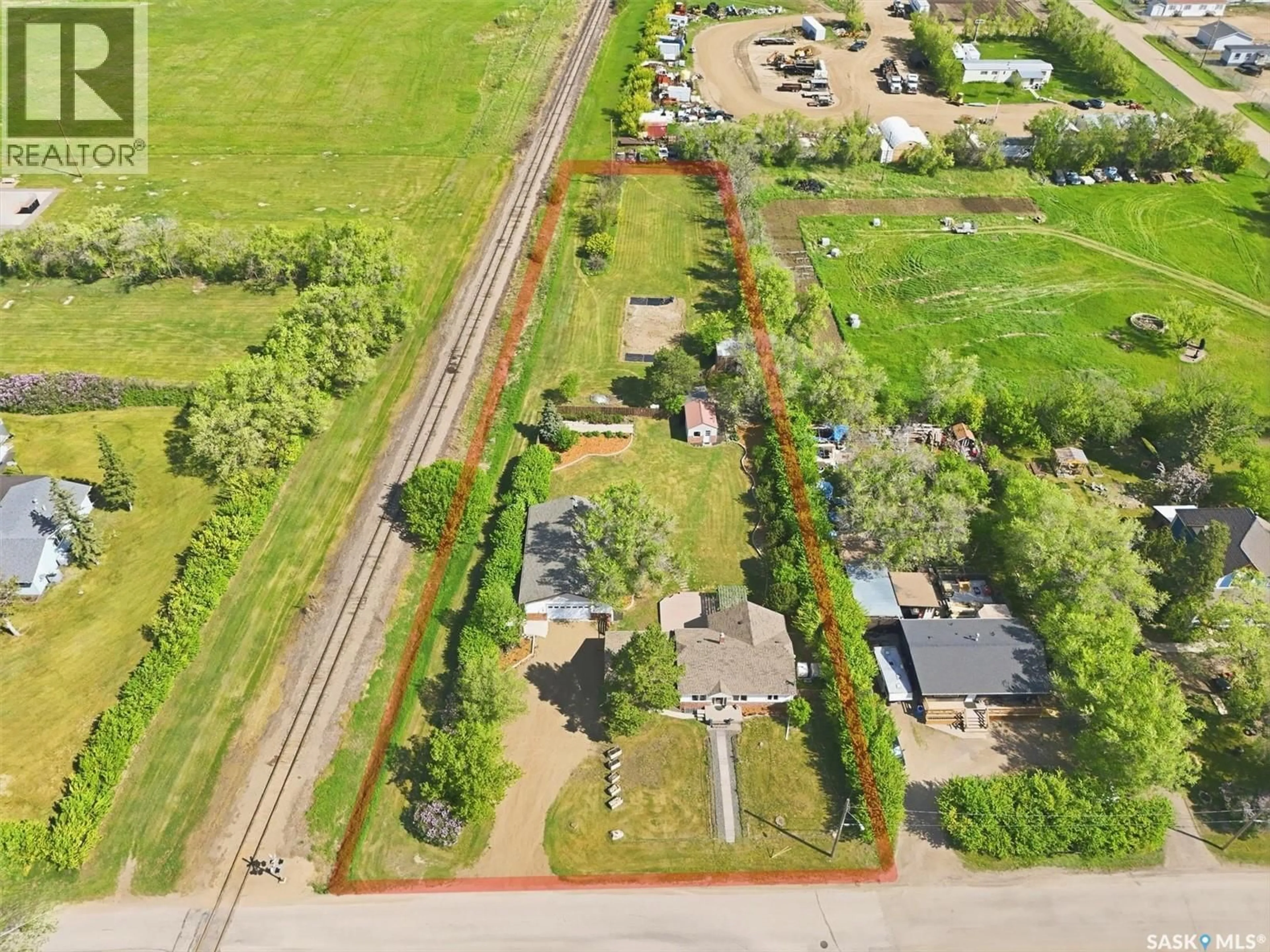 A pic from outside/outdoor area/front of a property/back of a property/a pic from drone, street for 503 3RD STREET, Dundurn Saskatchewan S0K1K0
