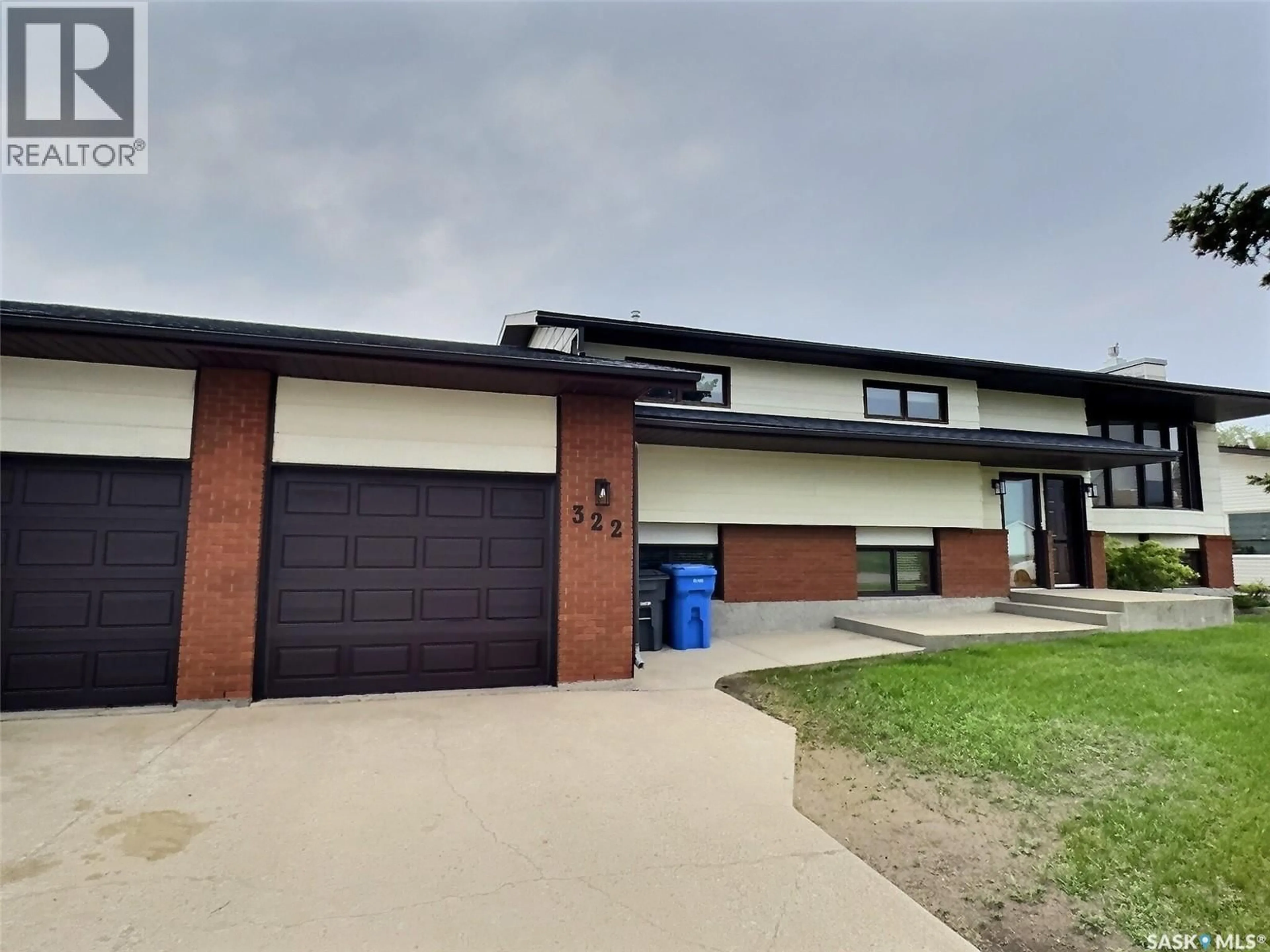 Home with brick exterior material, street for 322 SPRUCE DRIVE, Estevan Saskatchewan S4A2G1