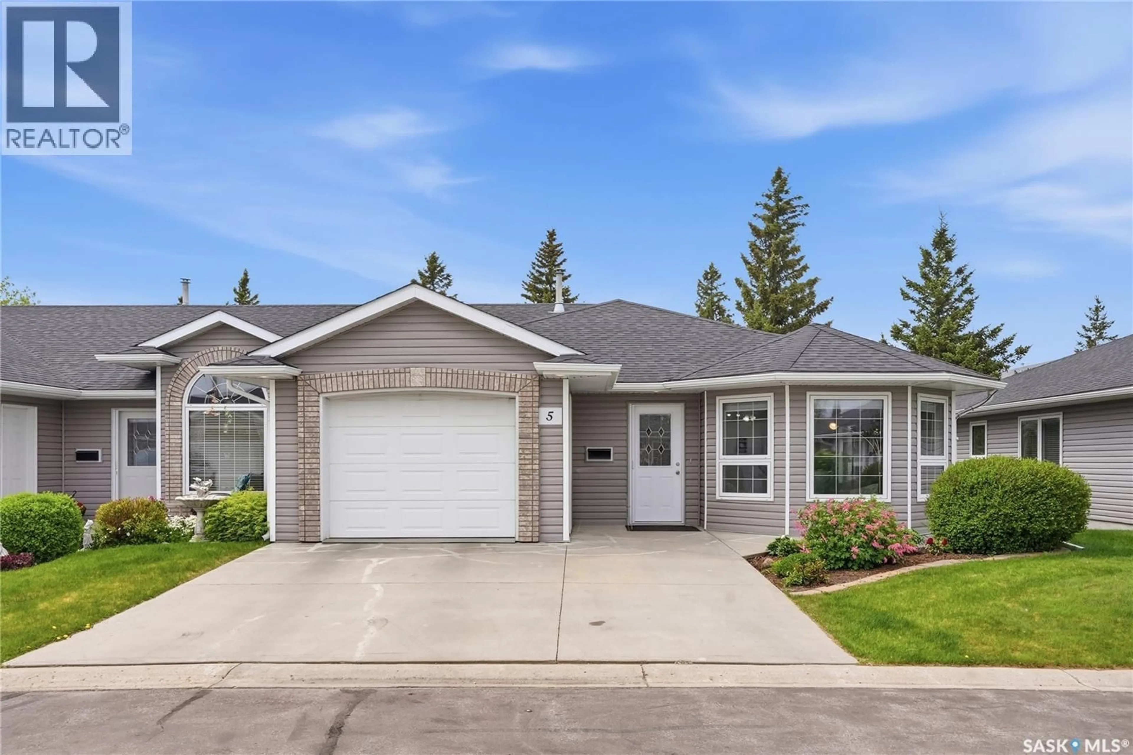 Home with vinyl exterior material, street for 5 206 ROSS AVENUE, Dalmeny Saskatchewan S0K1E0