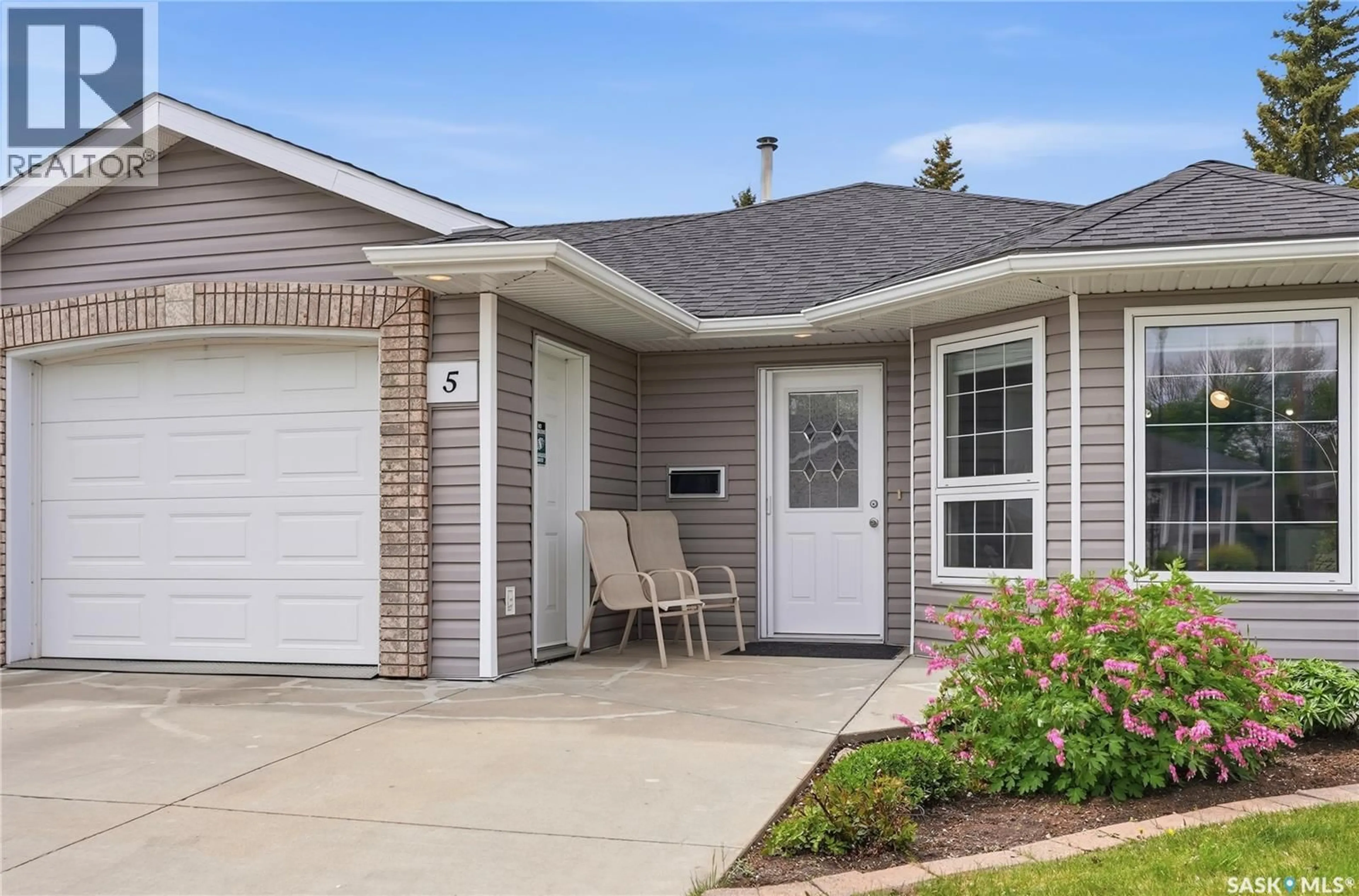 Home with vinyl exterior material, street for 5 206 ROSS AVENUE, Dalmeny Saskatchewan S0K1E0