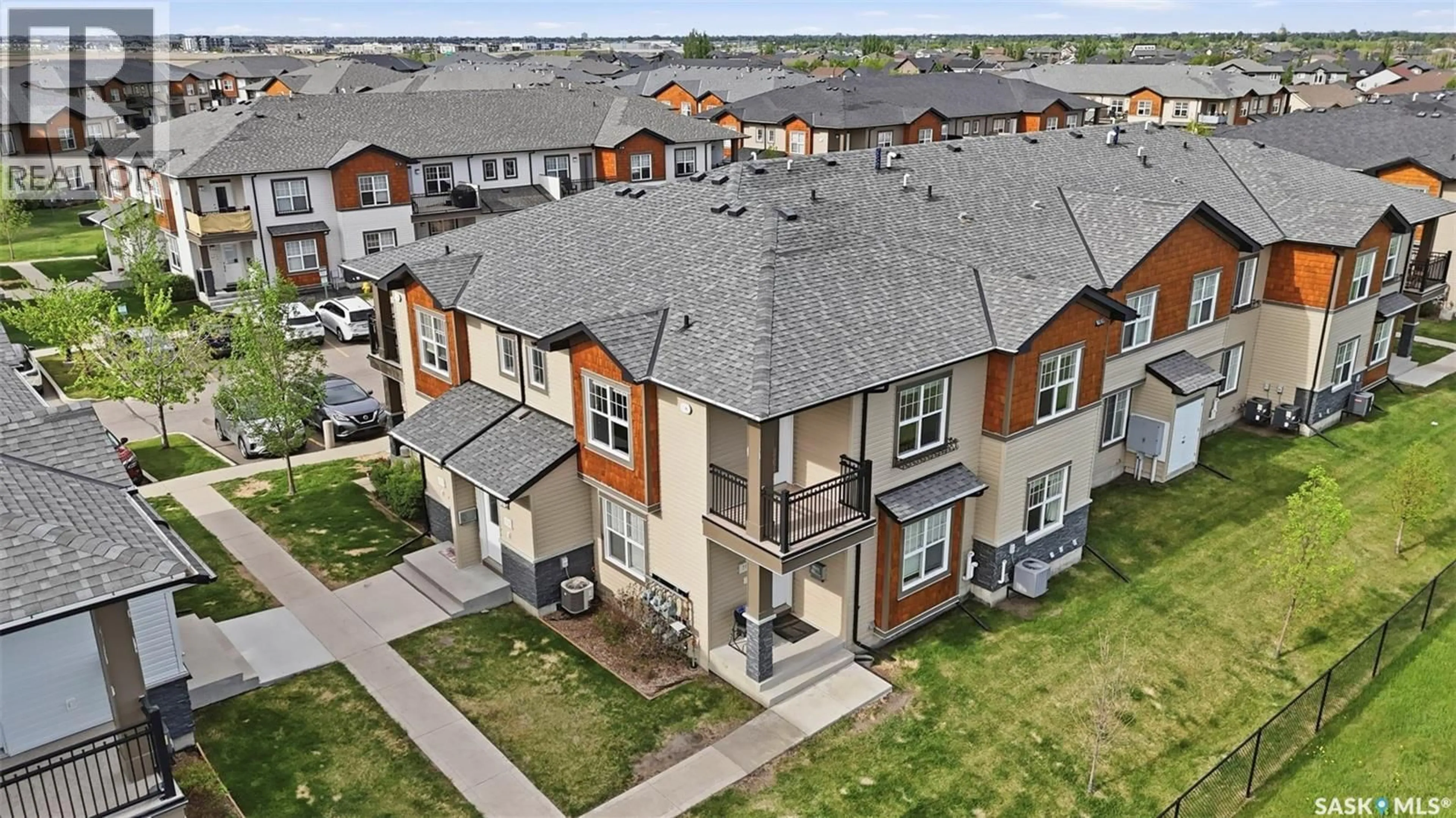 A pic from outside/outdoor area/front of a property/back of a property/a pic from drone, unknown for 1015 - 712 PATRICK CRESCENT, Saskatoon Saskatchewan S7W0M1