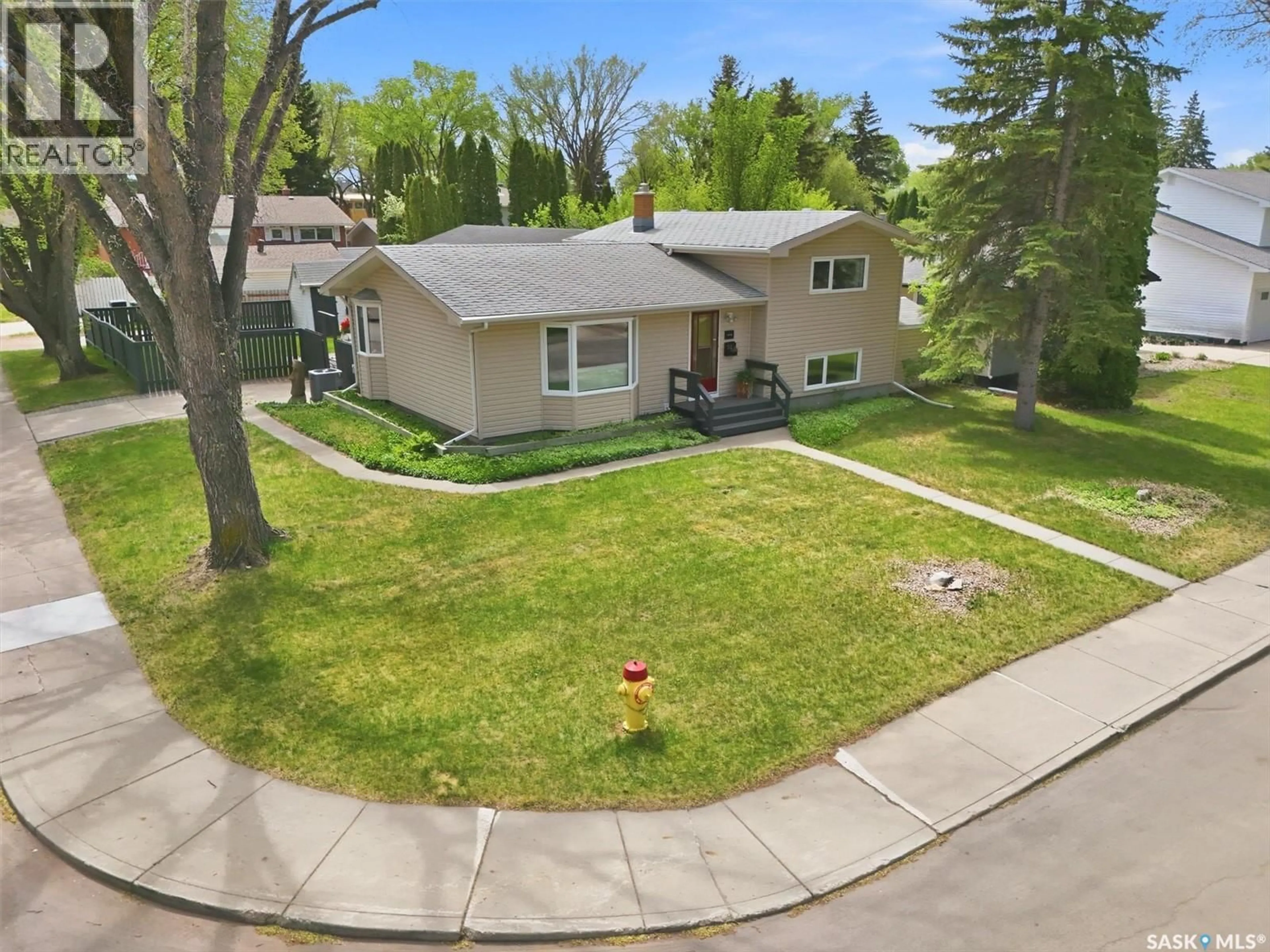 A pic from outside/outdoor area/front of a property/back of a property/a pic from drone, street for 52 POTTER CRESCENT, Saskatoon Saskatchewan S7H3L3