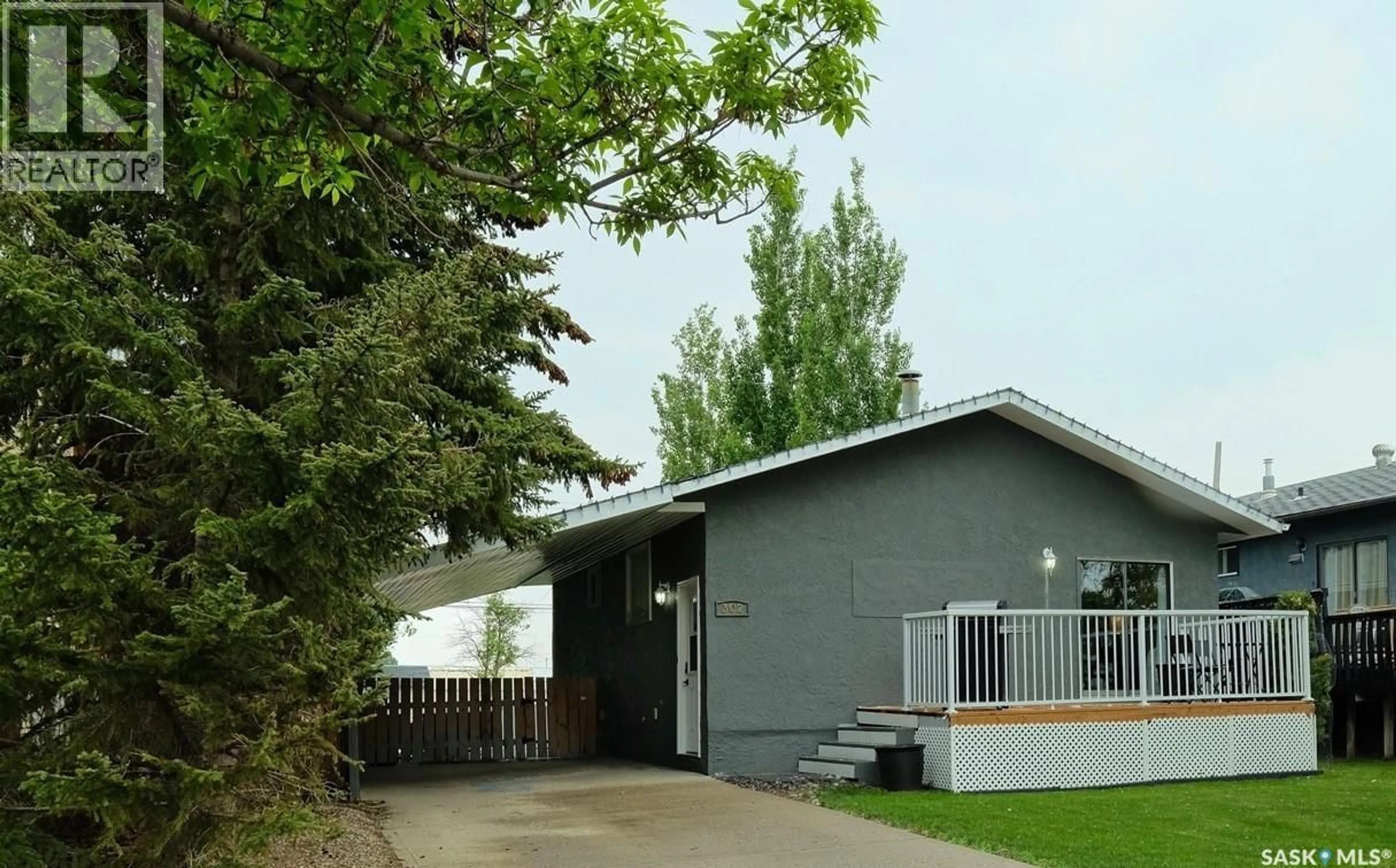 Home with vinyl exterior material, street for 302 7TH STREET, Rosetown Saskatchewan S0L2V0
