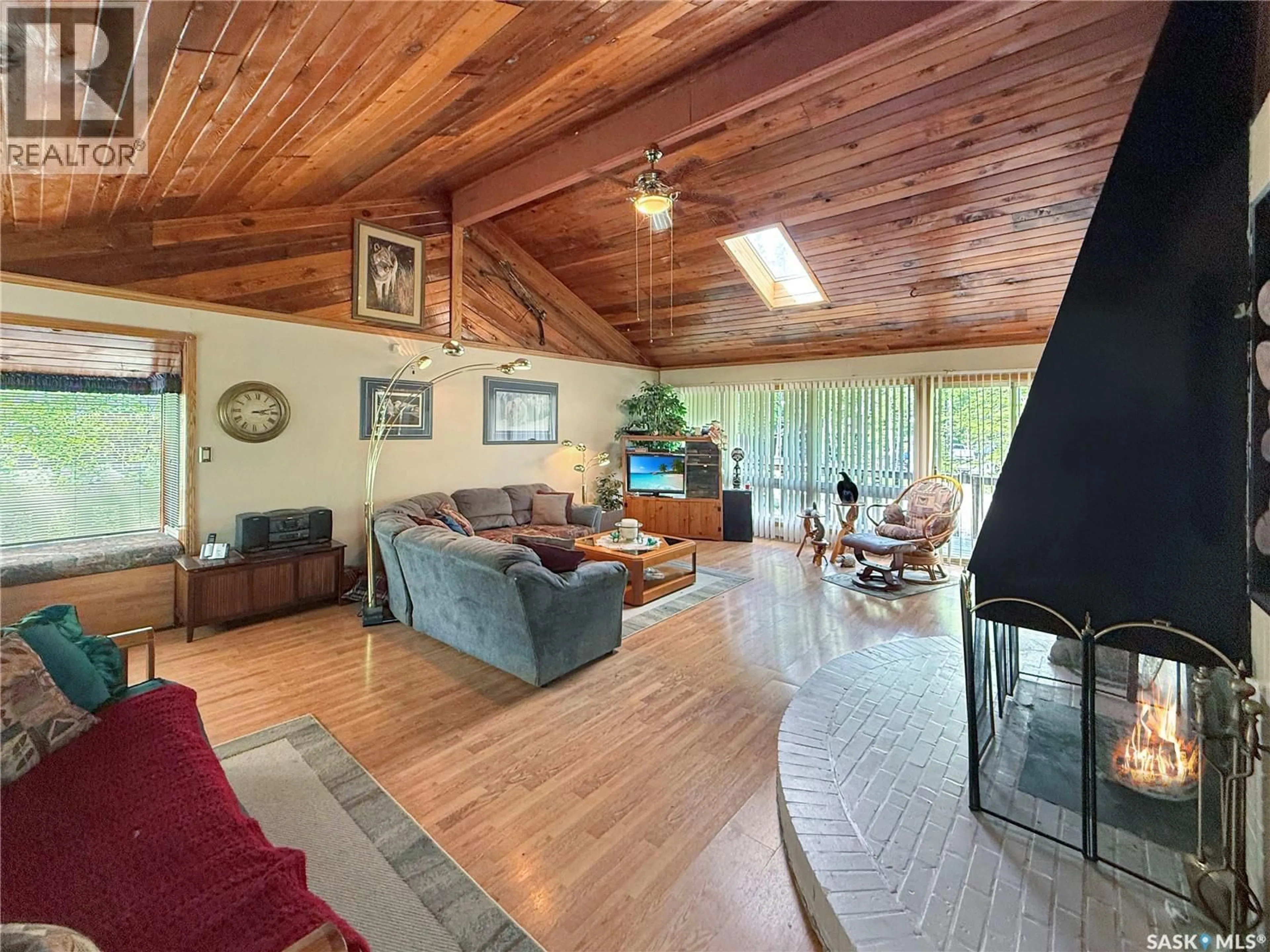 Living room with furniture, wood/laminate floor for 10 FIRST AVENUE, Candle Lake Saskatchewan S0J3E0