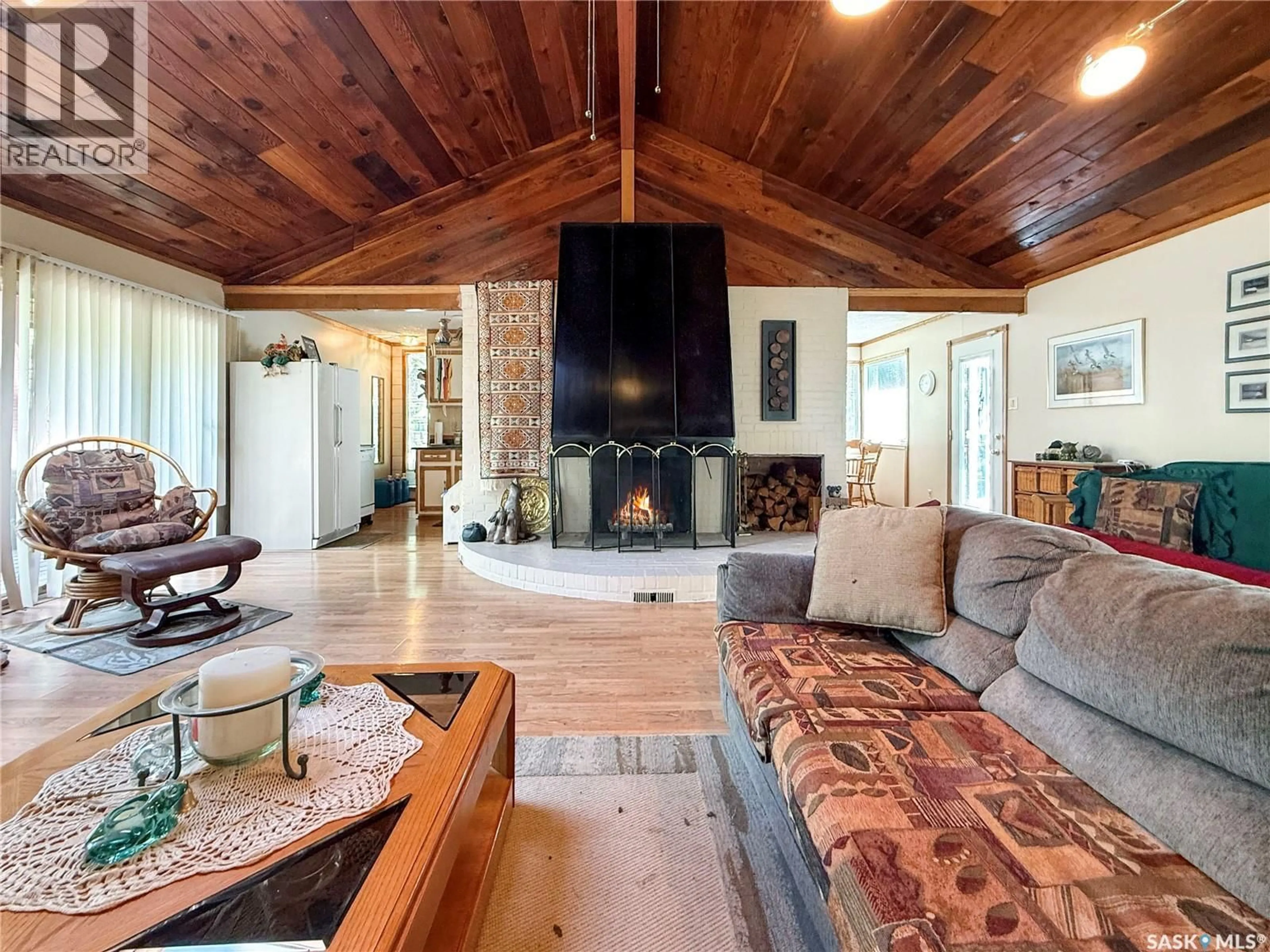 Living room with furniture, wood/laminate floor for 10 FIRST AVENUE, Candle Lake Saskatchewan S0J3E0