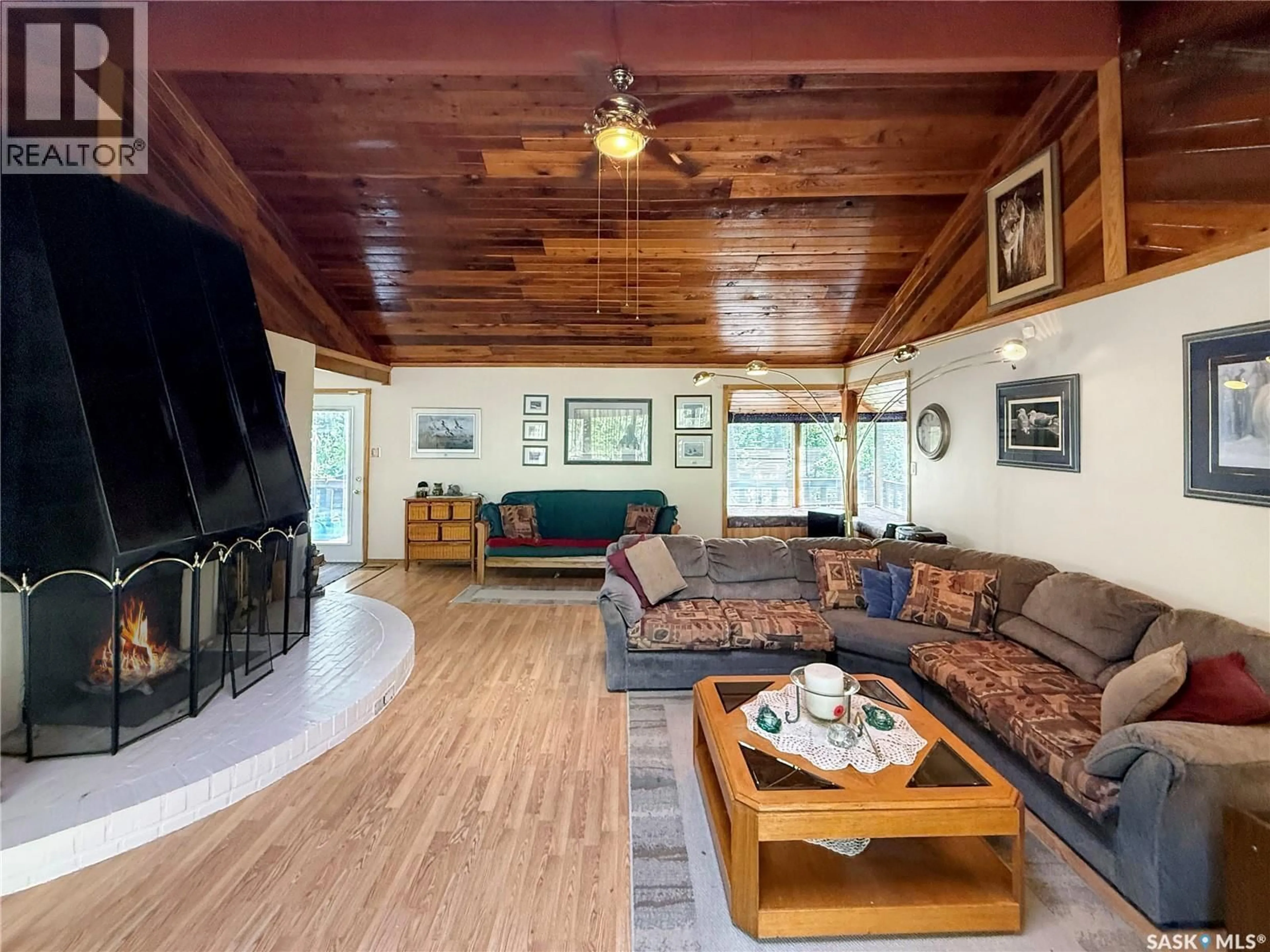 Living room with furniture, wood/laminate floor for 10 FIRST AVENUE, Candle Lake Saskatchewan S0J3E0