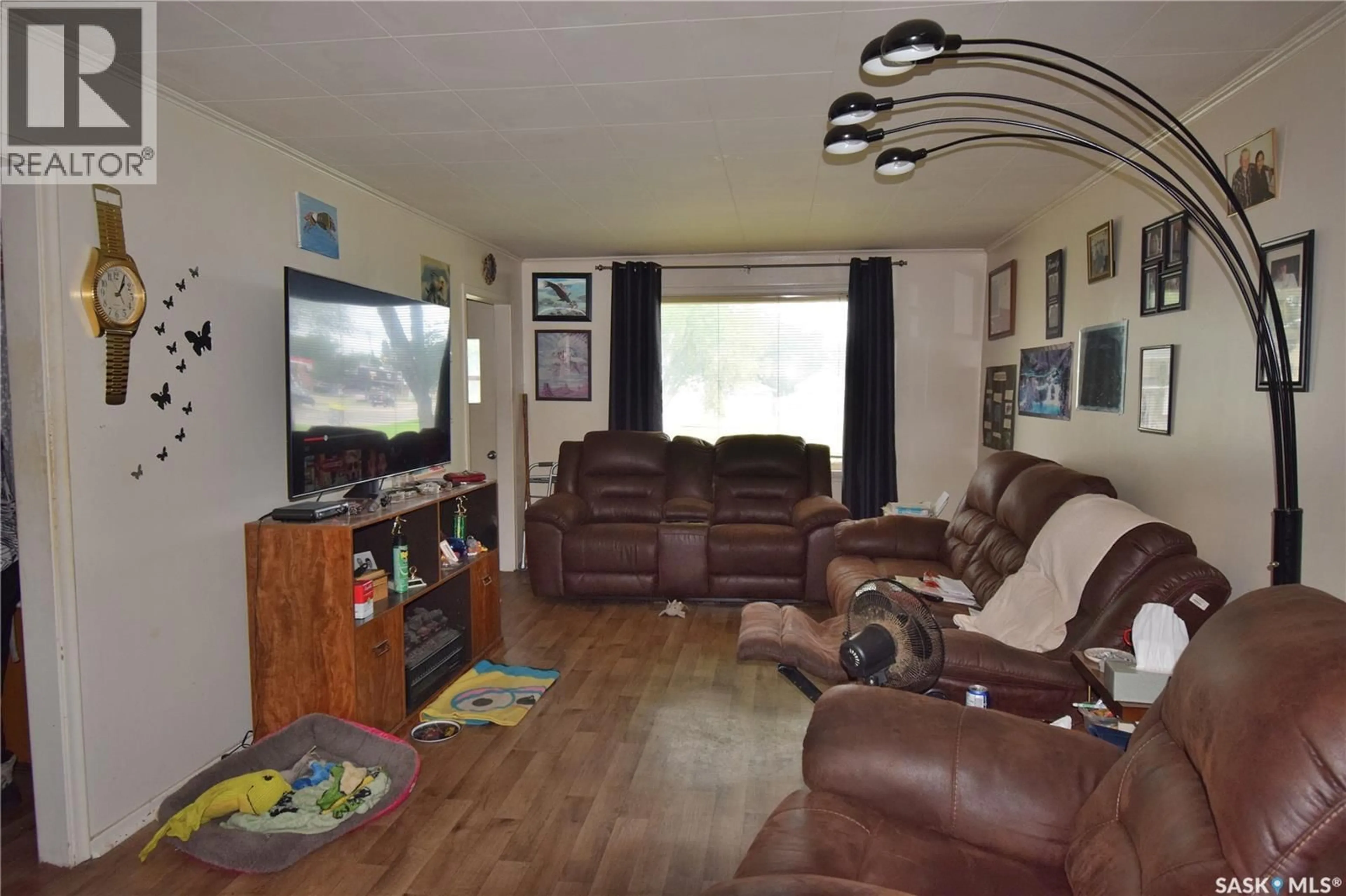 Living room with furniture, wood/laminate floor for 579 25TH STREET, Prince Albert Saskatchewan S6V1T4