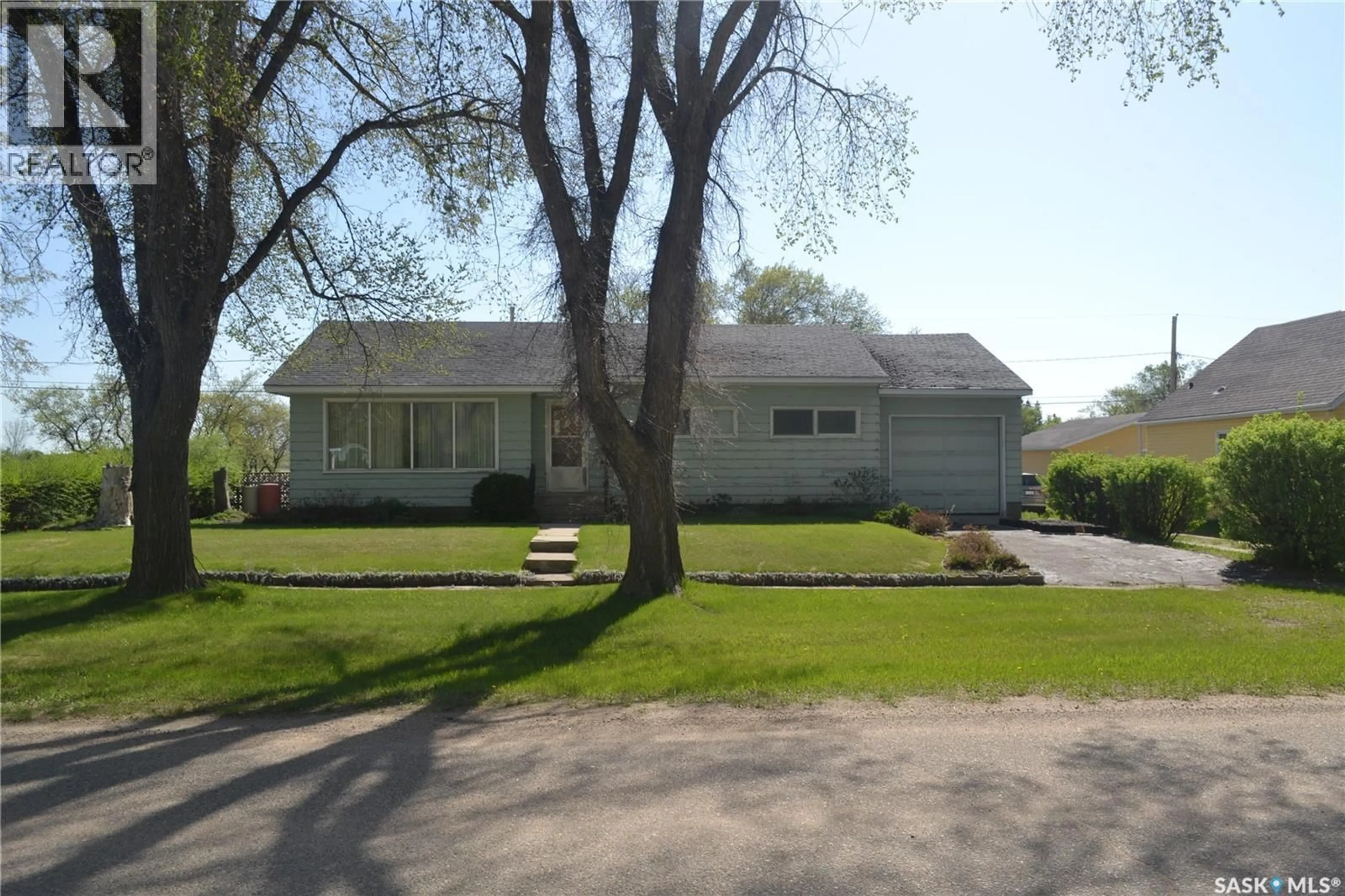 Home with vinyl exterior material, street for 100 MAIN STREET, Radisson Saskatchewan S0K3L0
