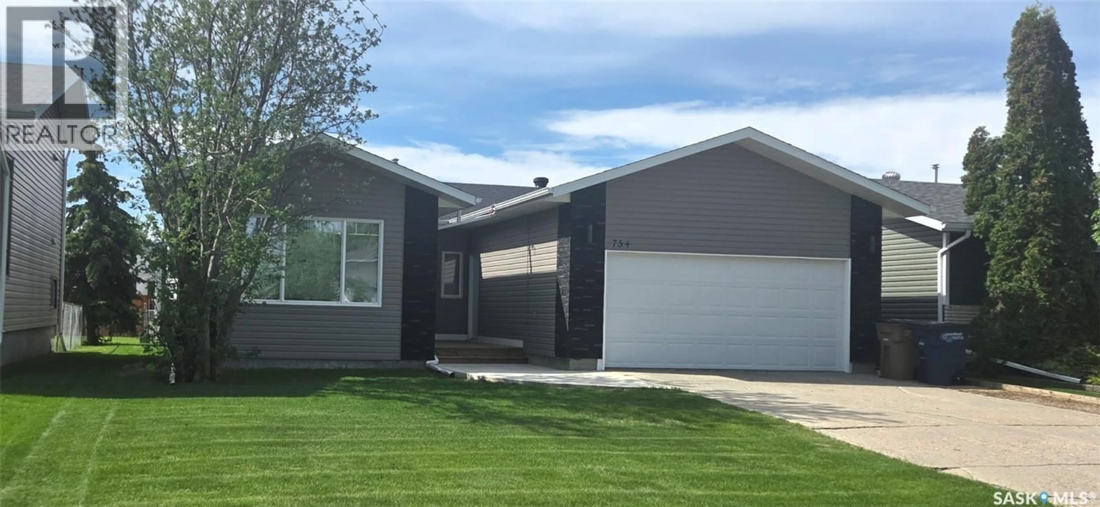 Home with vinyl exterior material, street for 754 GOLBURN CRESCENT, Tisdale Saskatchewan S0E1T0