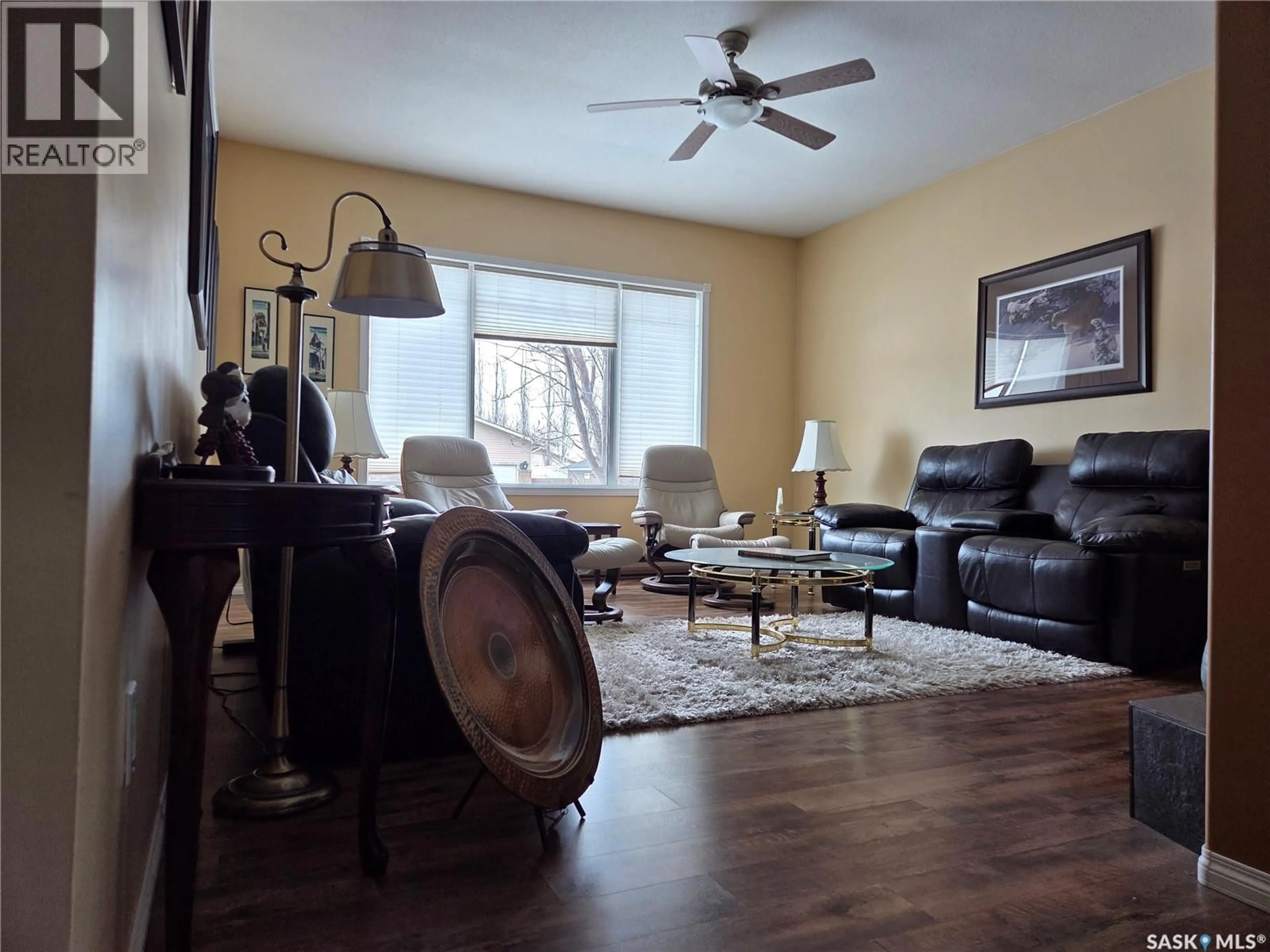 Living room with furniture, wood/laminate floor for 754 GOLBURN CRESCENT, Tisdale Saskatchewan S0E1T0
