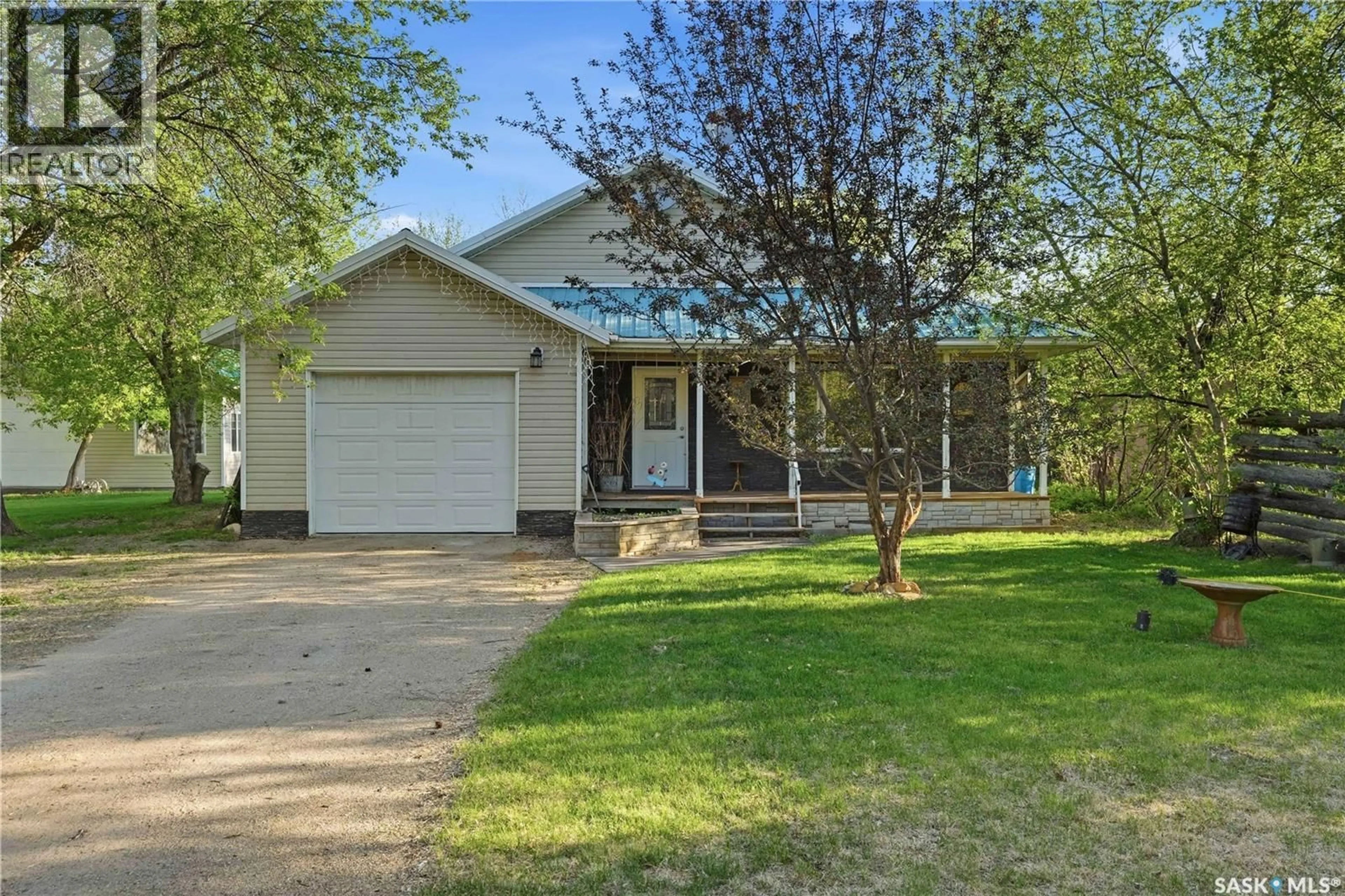 Home with vinyl exterior material, street for 242 WOODLAWN AVENUE, Katepwa Beach Saskatchewan S0G2Y0