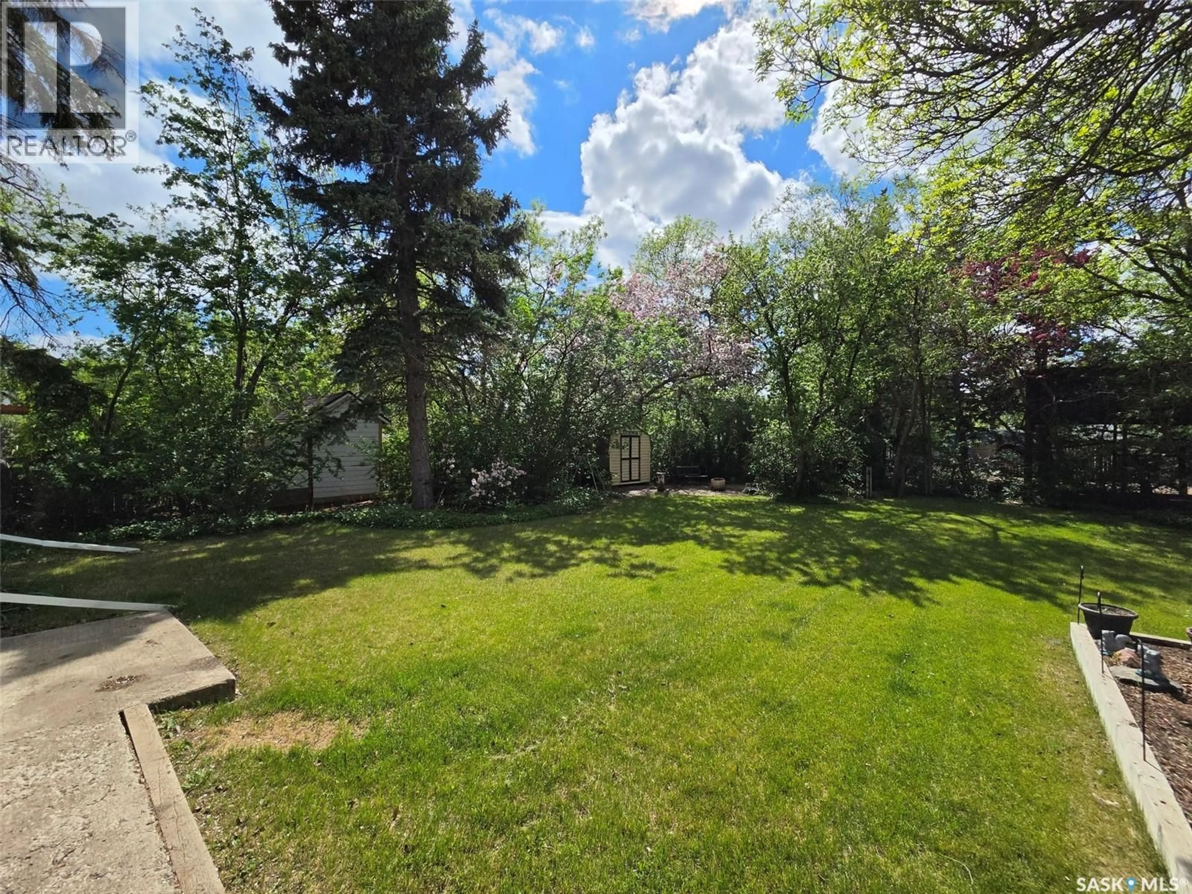 A pic from outside/outdoor area/front of a property/back of a property/a pic from drone, forest/trees view for 118 5TH STREET, Carlyle Saskatchewan S0C0R0
