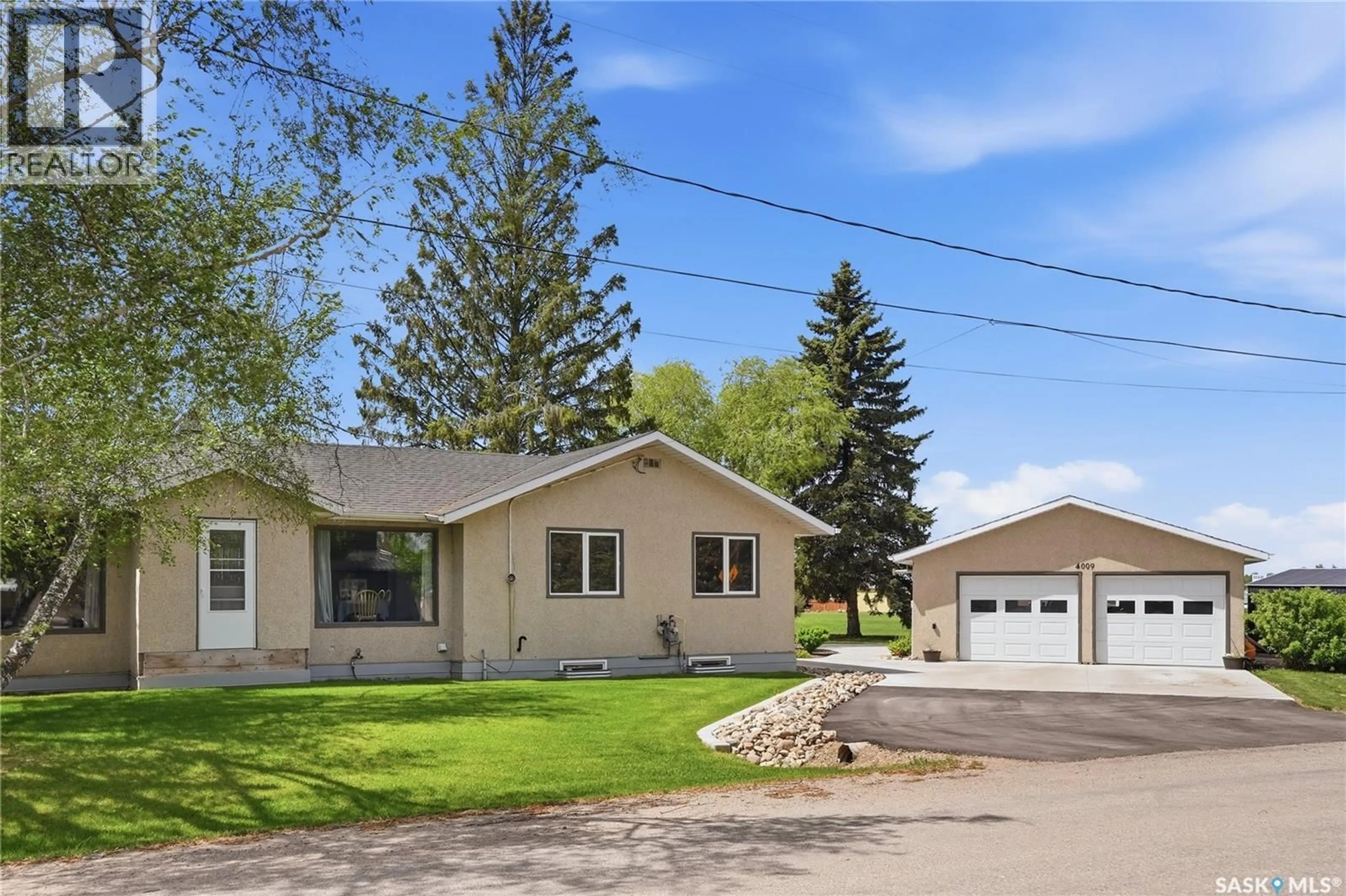 Home with vinyl exterior material, street for 4009 CENTRAL AVENUE, Laird Saskatchewan S0K2H0