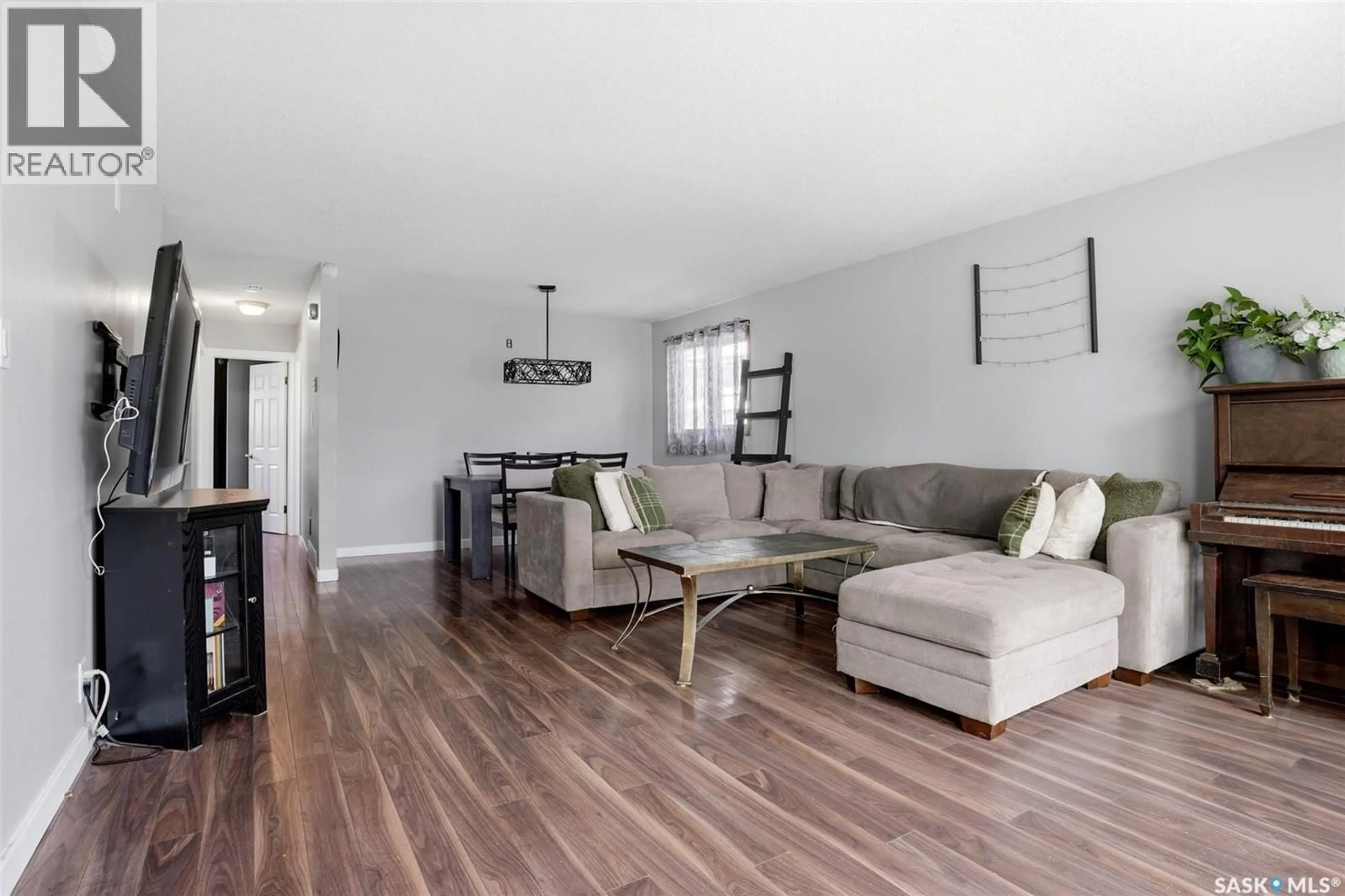Living room with furniture, wood/laminate floor for 810 PRINCESS STREET, Regina Saskatchewan S4T3X9