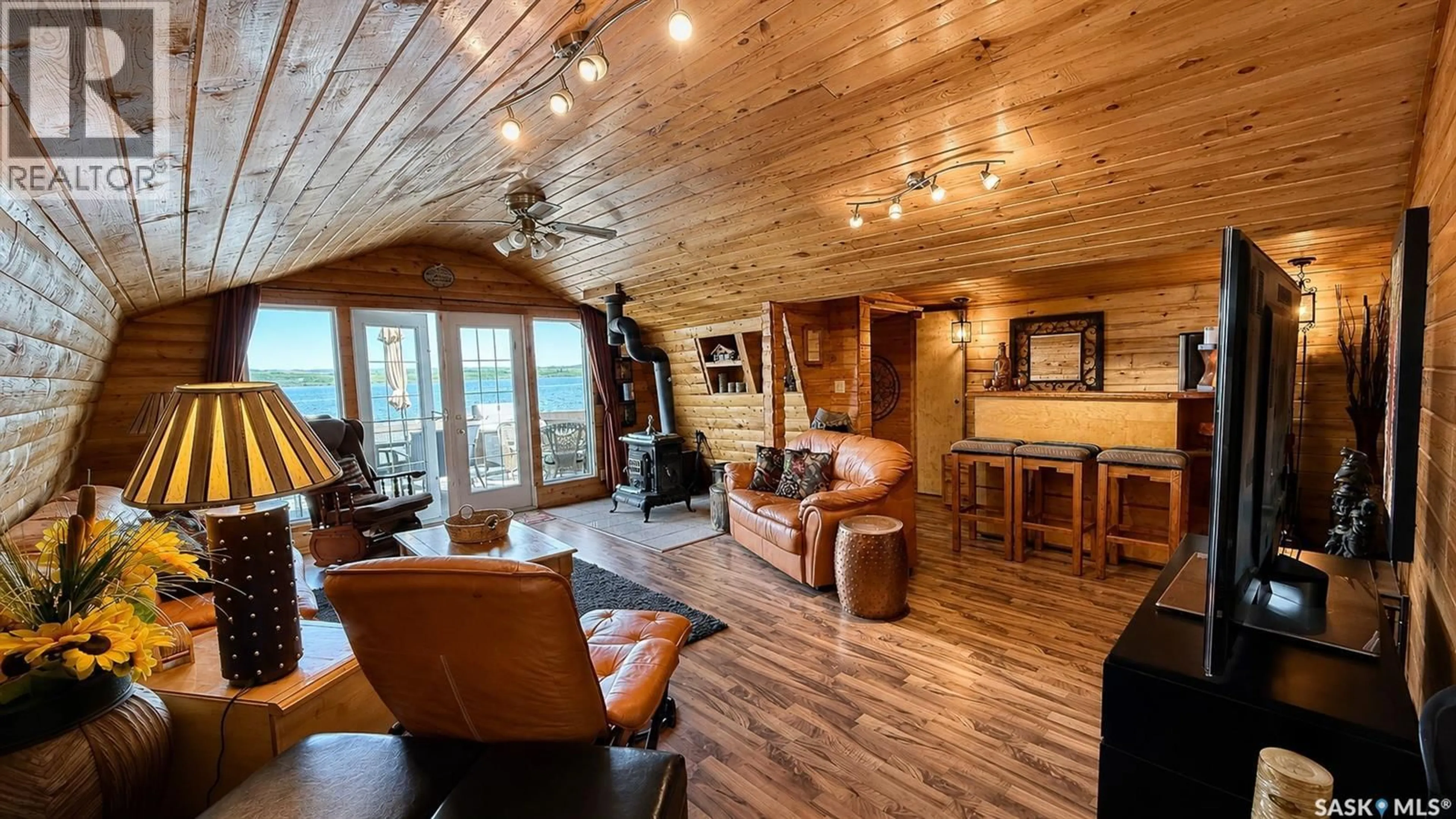 Living room with furniture, wood/laminate floor for 26 MURRAY LAKE CRESCENT, Meota Rm No.468 Saskatchewan S0M0L0