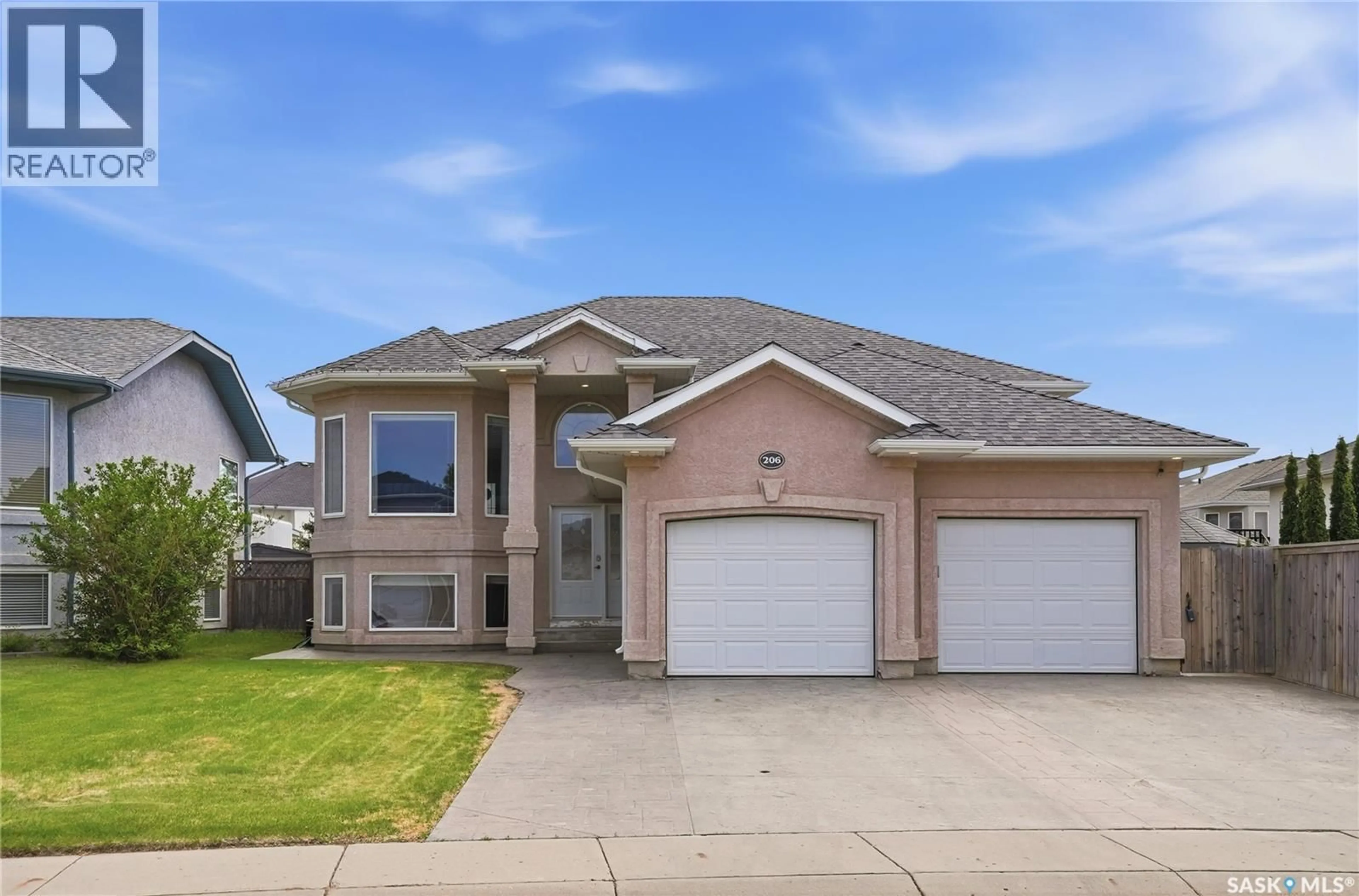 Home with brick exterior material, street for 206 CARR LANE, Saskatoon Saskatchewan S7S1M3