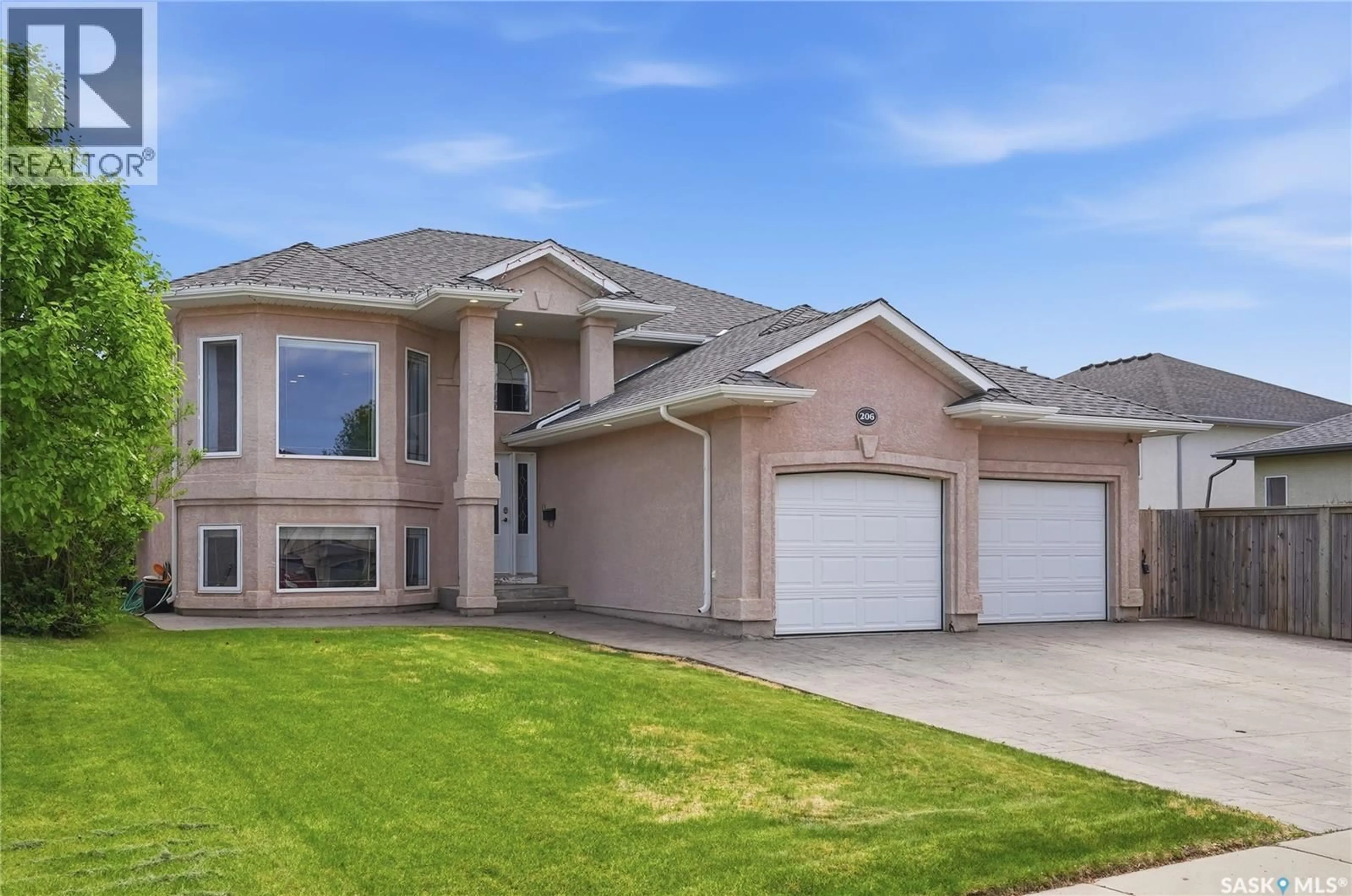 Home with brick exterior material, street for 206 CARR LANE, Saskatoon Saskatchewan S7S1M3