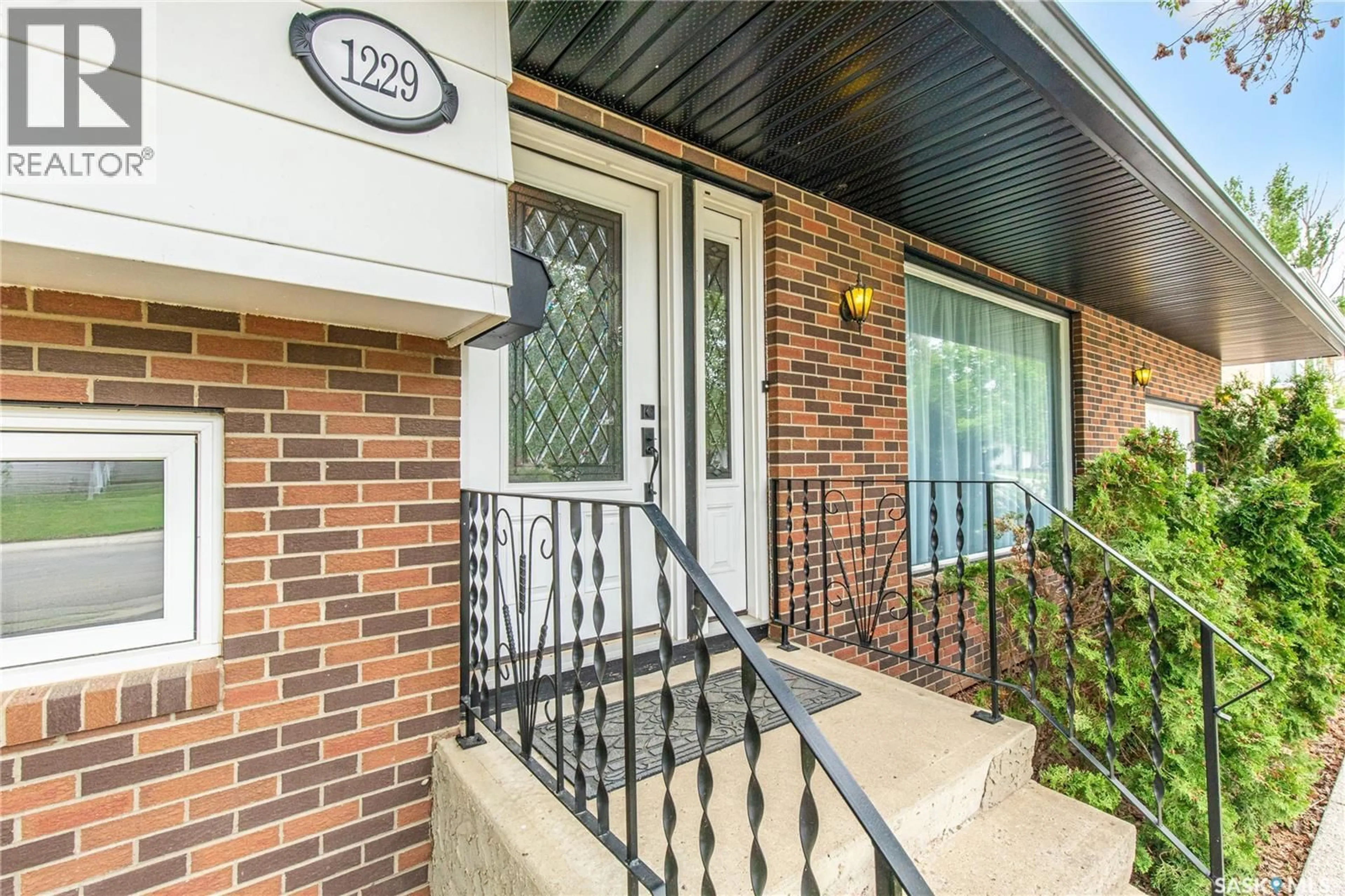 Home with brick exterior material, street for 1229 PASCOE DRIVE, Moose Jaw Saskatchewan S6H6Z4