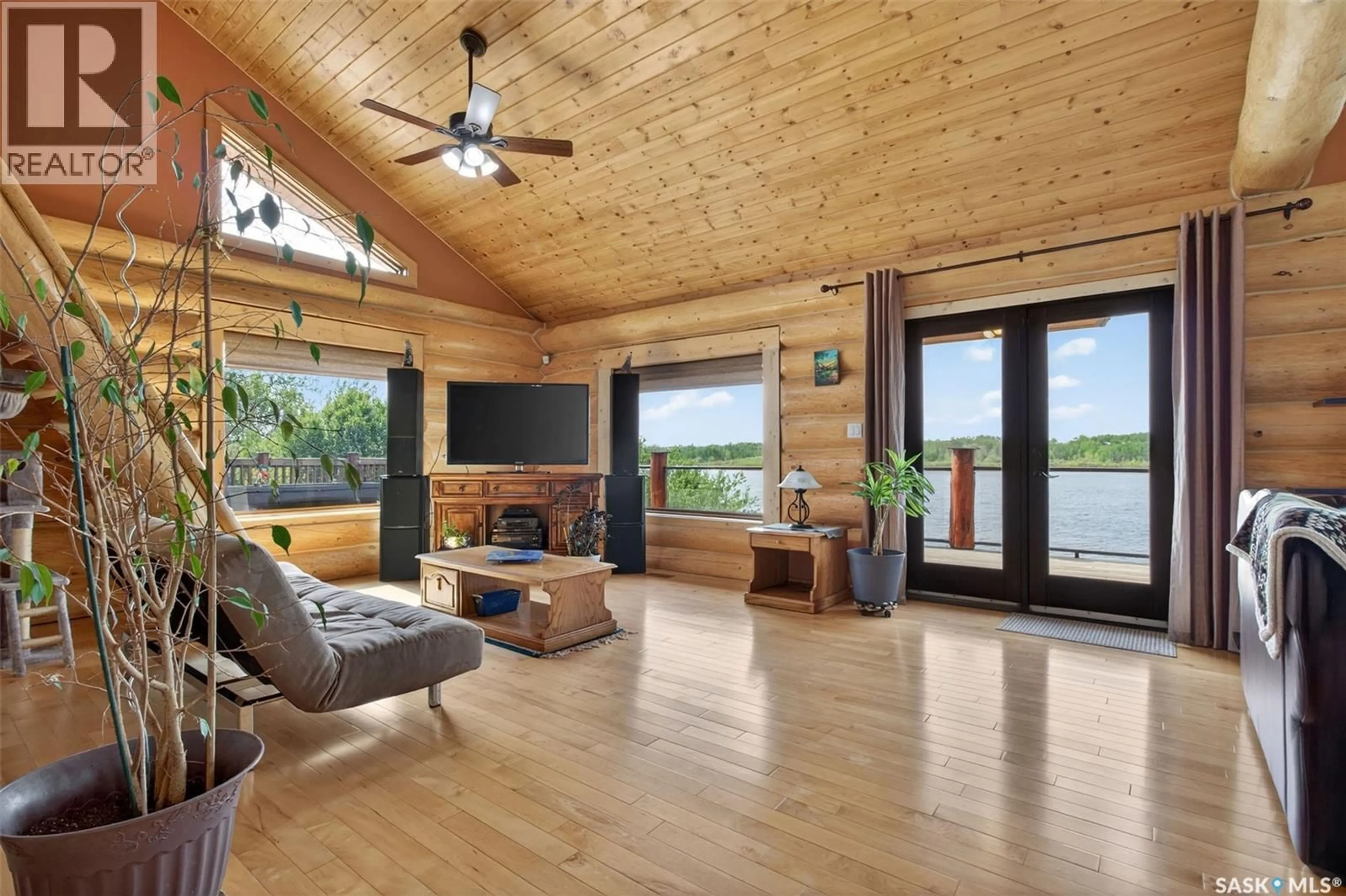 Living room with furniture, wood/laminate floor for FLATWATER RANCH, Duck Lake Rm No. 463 Saskatchewan S0K1J0