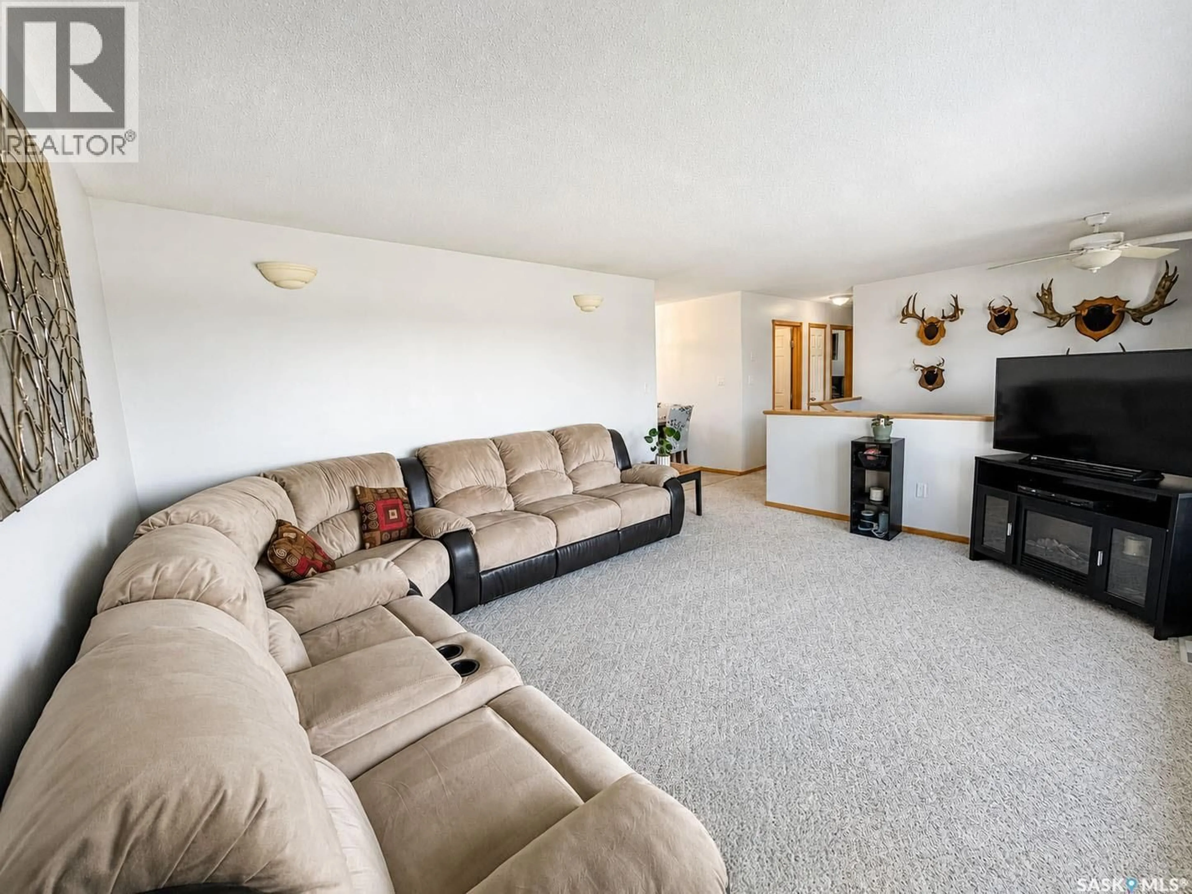 Living room with furniture, carpet floor for 761 3RD STREET, Prince Albert Saskatchewan S6V0H7