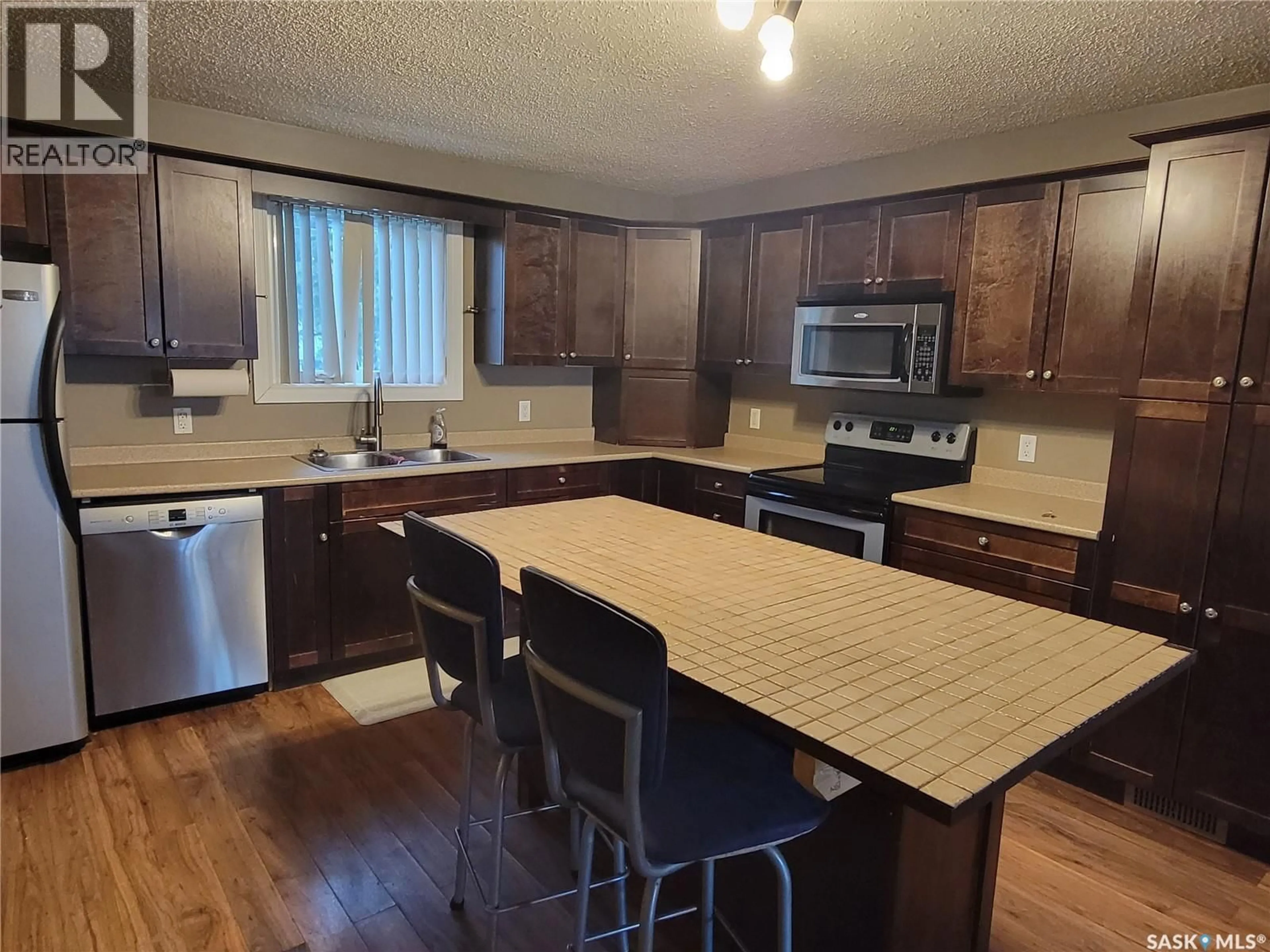 Open concept kitchen, wood/laminate floor for 4705 TRIBUNE STREET, Macklin Saskatchewan S0L2C0