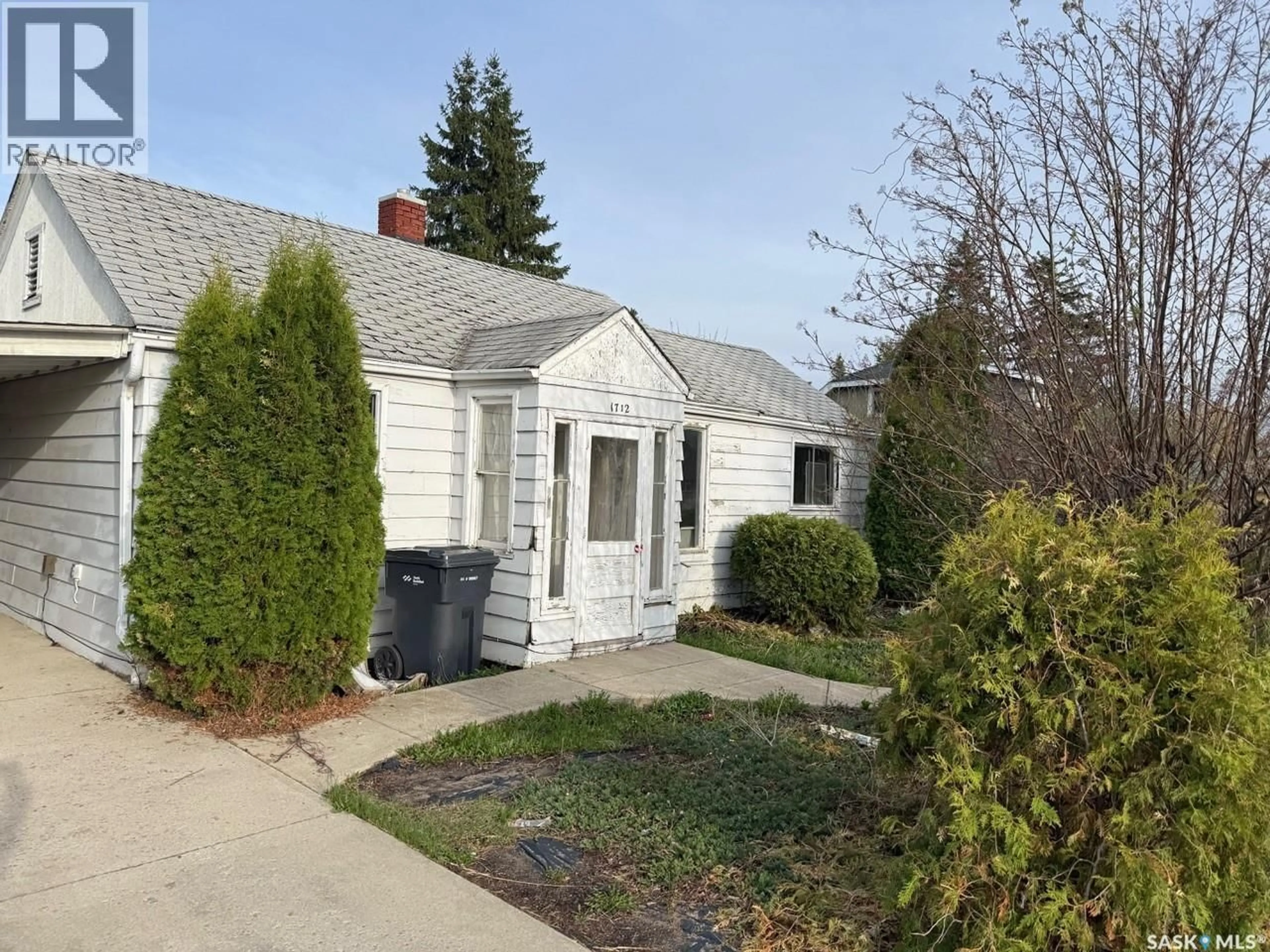 Home with vinyl exterior material, street for 1712 103RD STREET, North Battleford Saskatchewan S9A1L9