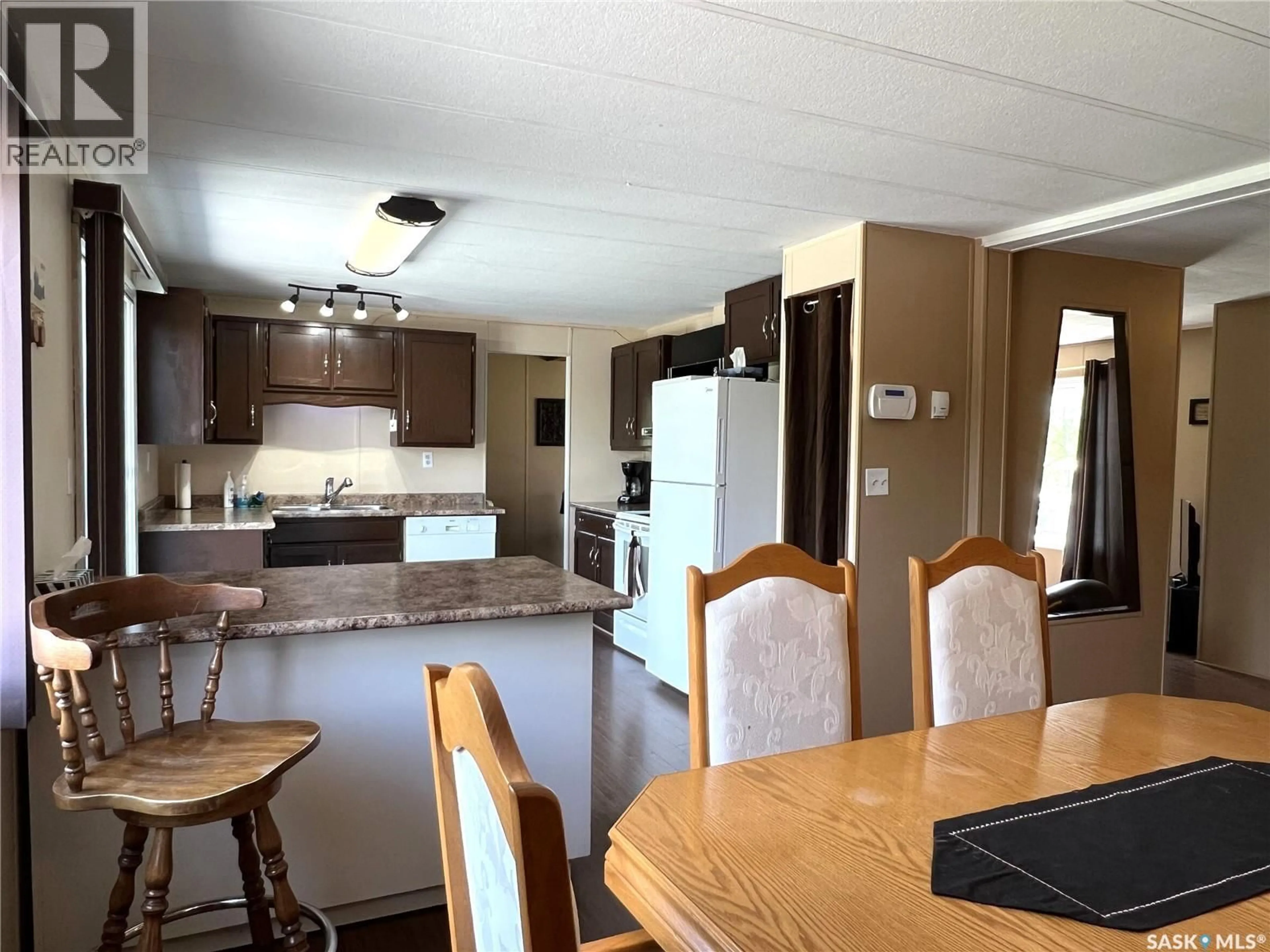Open concept kitchen, wood/laminate floor for 303 MAIN STREET, Green Lake Saskatchewan S0M1B0