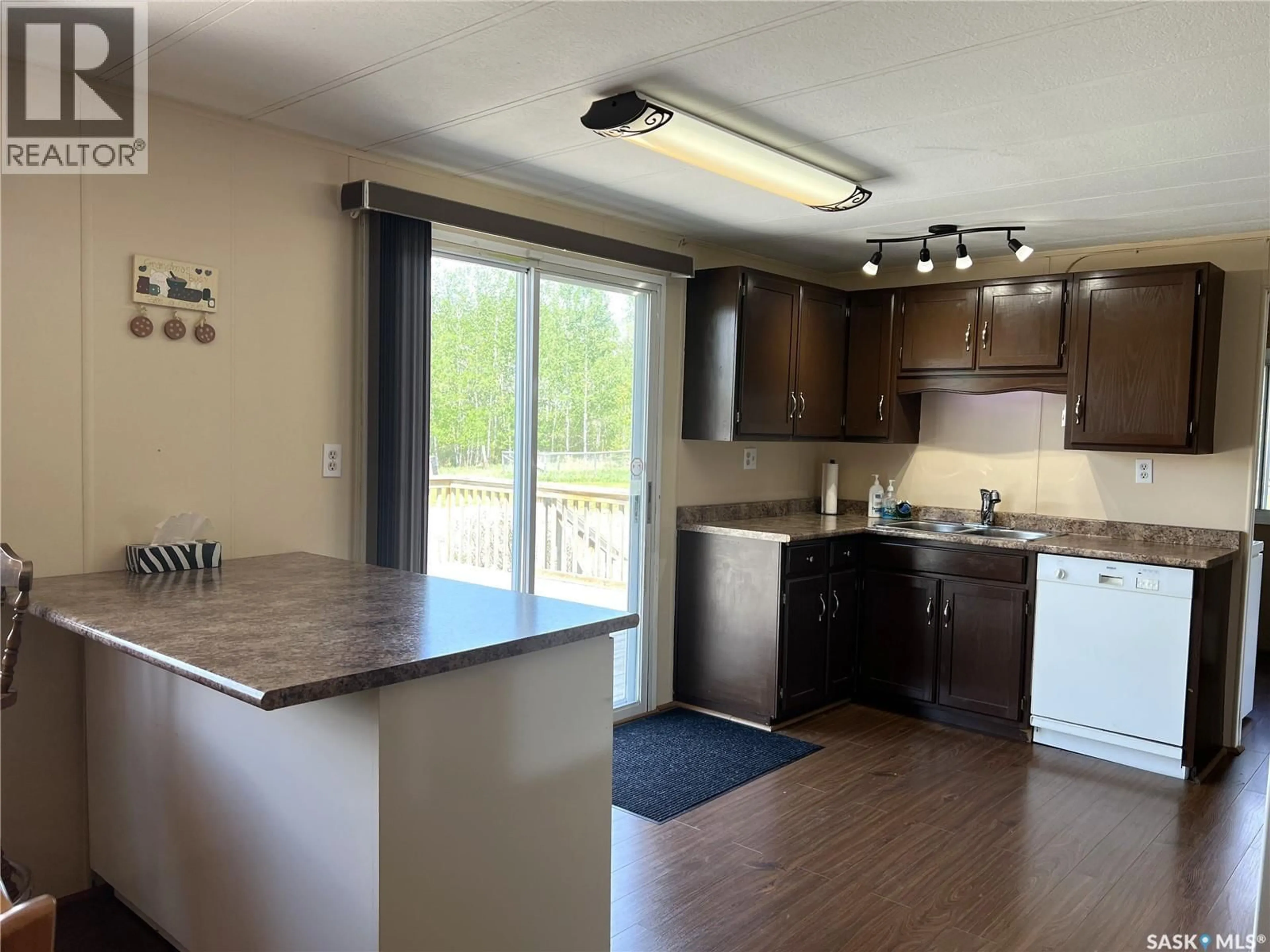 Open concept kitchen, wood/laminate floor for 303 MAIN STREET, Green Lake Saskatchewan S0M1B0