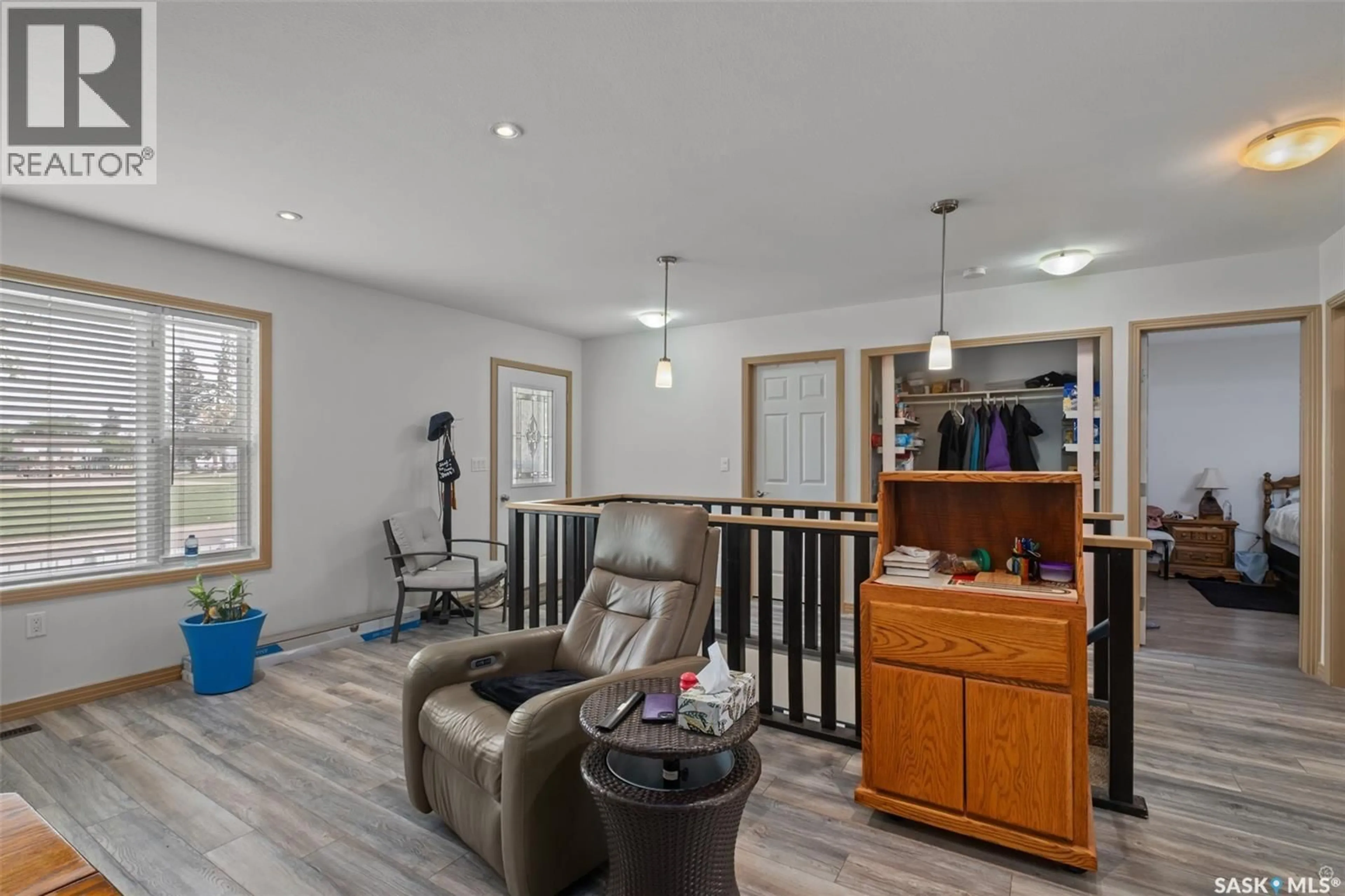 Living room with furniture, wood/laminate floor for 441 6TH STREET, Prince Albert Saskatchewan S6V0N3