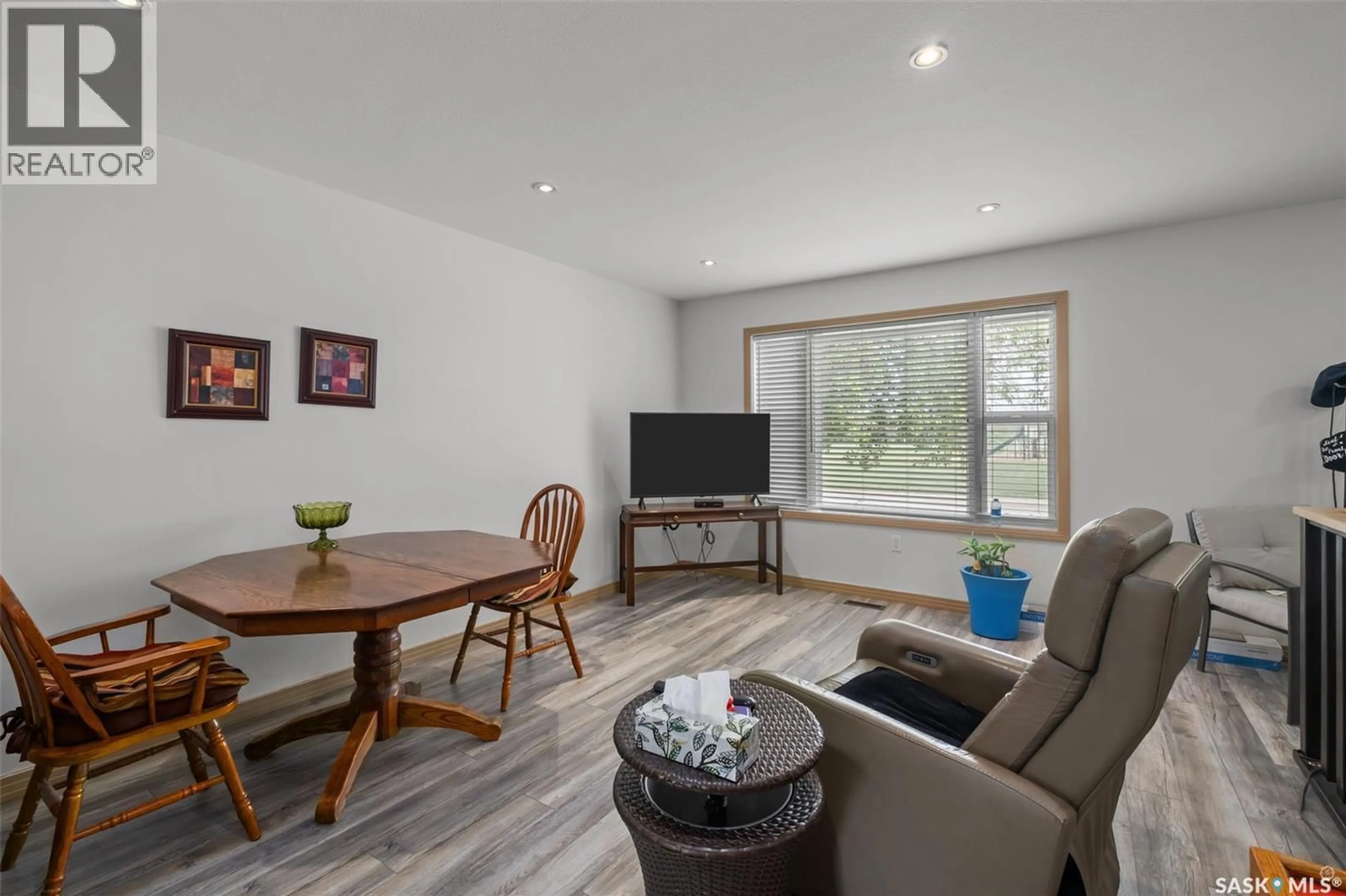 Living room with furniture, wood/laminate floor for 441 6TH STREET, Prince Albert Saskatchewan S6V0N3