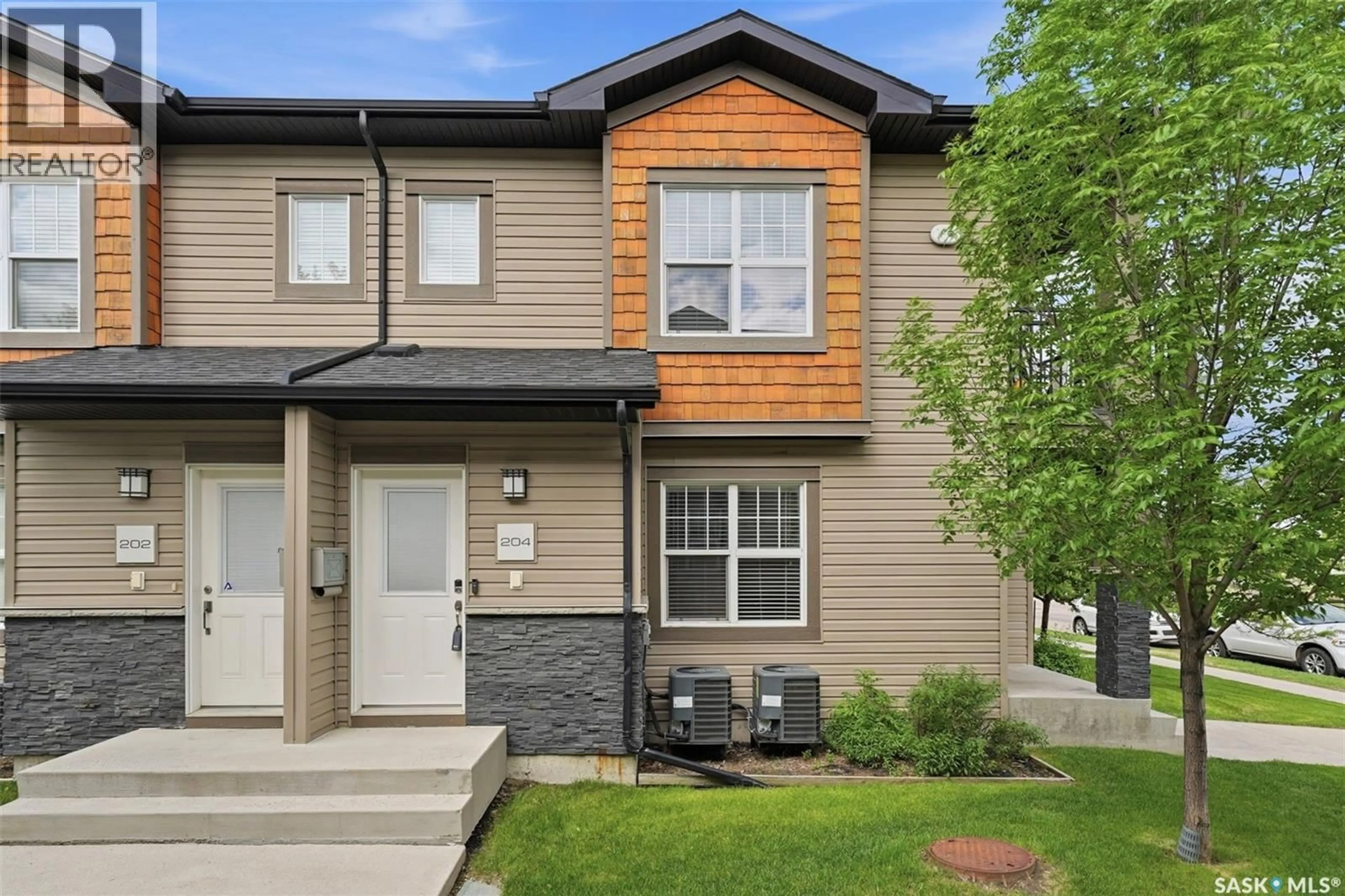 Home with vinyl exterior material, street for 204 - 3013 MCCLOCKLIN ROAD, Saskatoon Saskatchewan S7R0J1