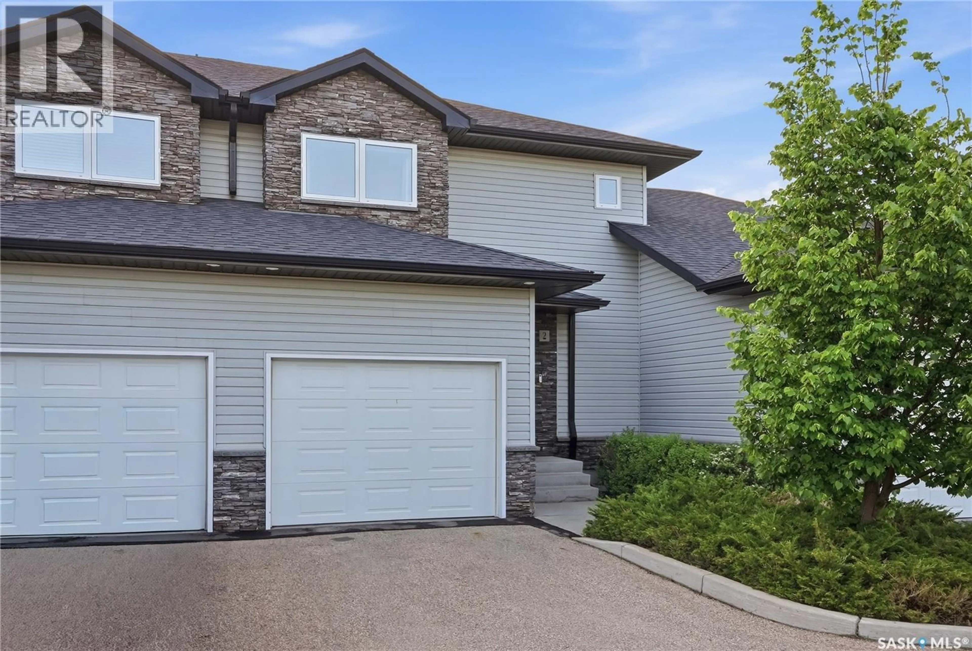 Home with vinyl exterior material, street for 2 547 EAST HAMPTON BOULEVARD, Saskatoon Saskatchewan S7R0B1