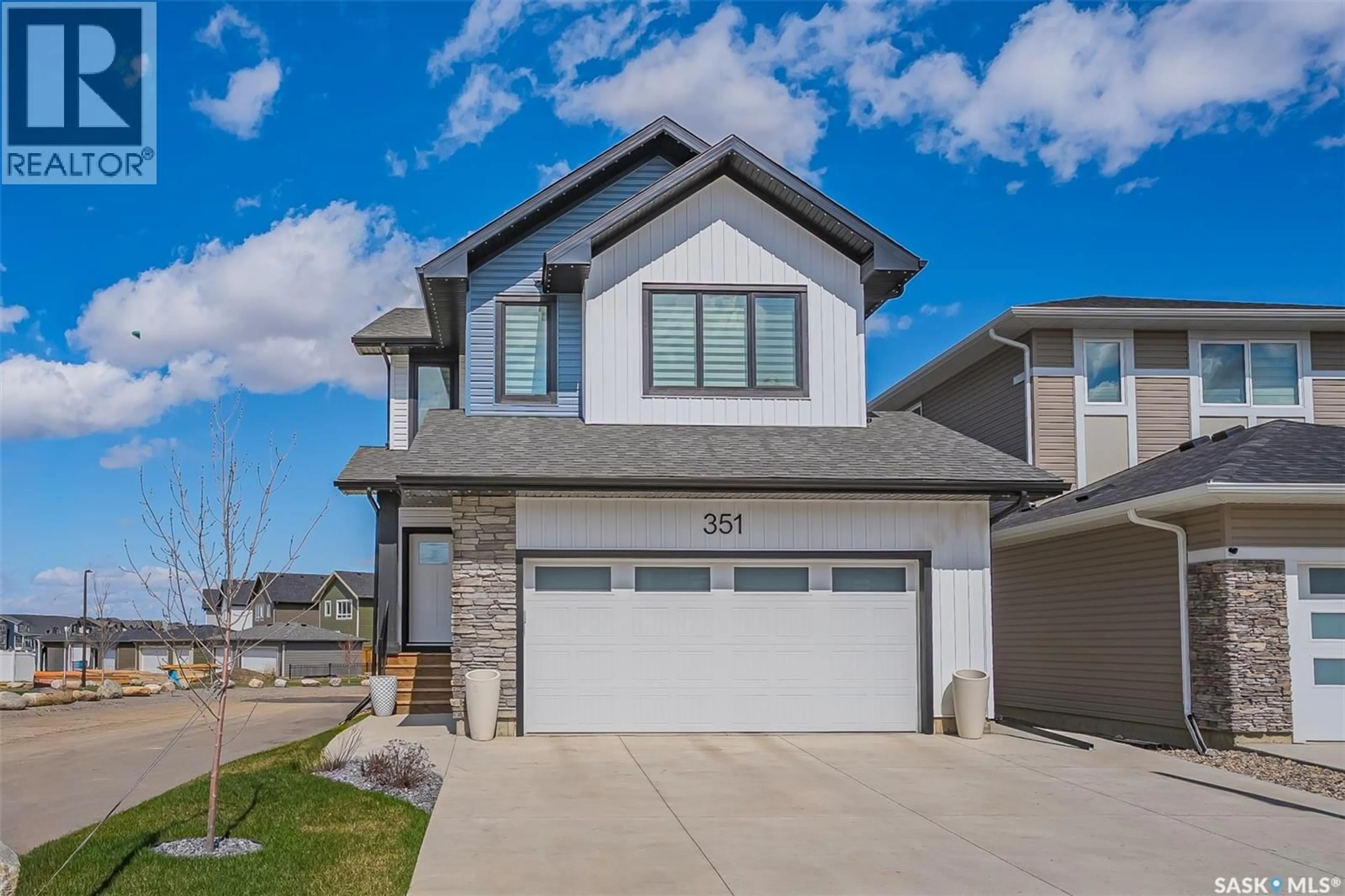 Home with vinyl exterior material, street for 351 ANISKOTAW BEND, Saskatoon Saskatchewan S7V1M1