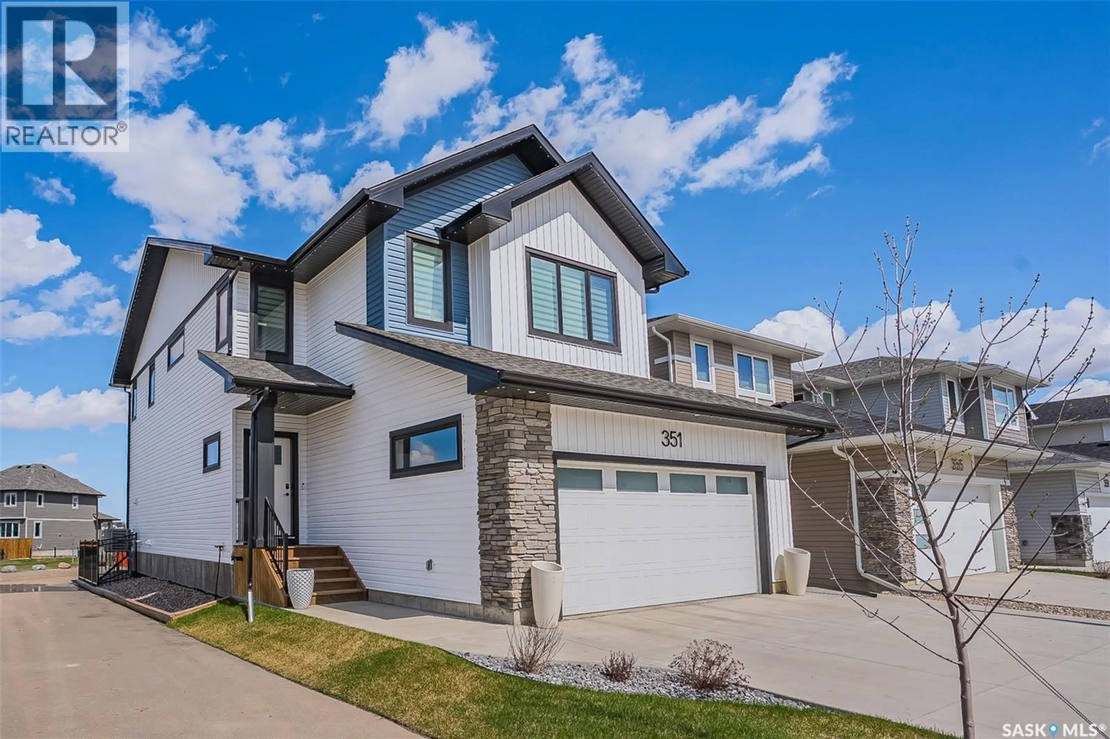 Home with vinyl exterior material, street for 351 ANISKOTAW BEND, Saskatoon Saskatchewan S7V1M1