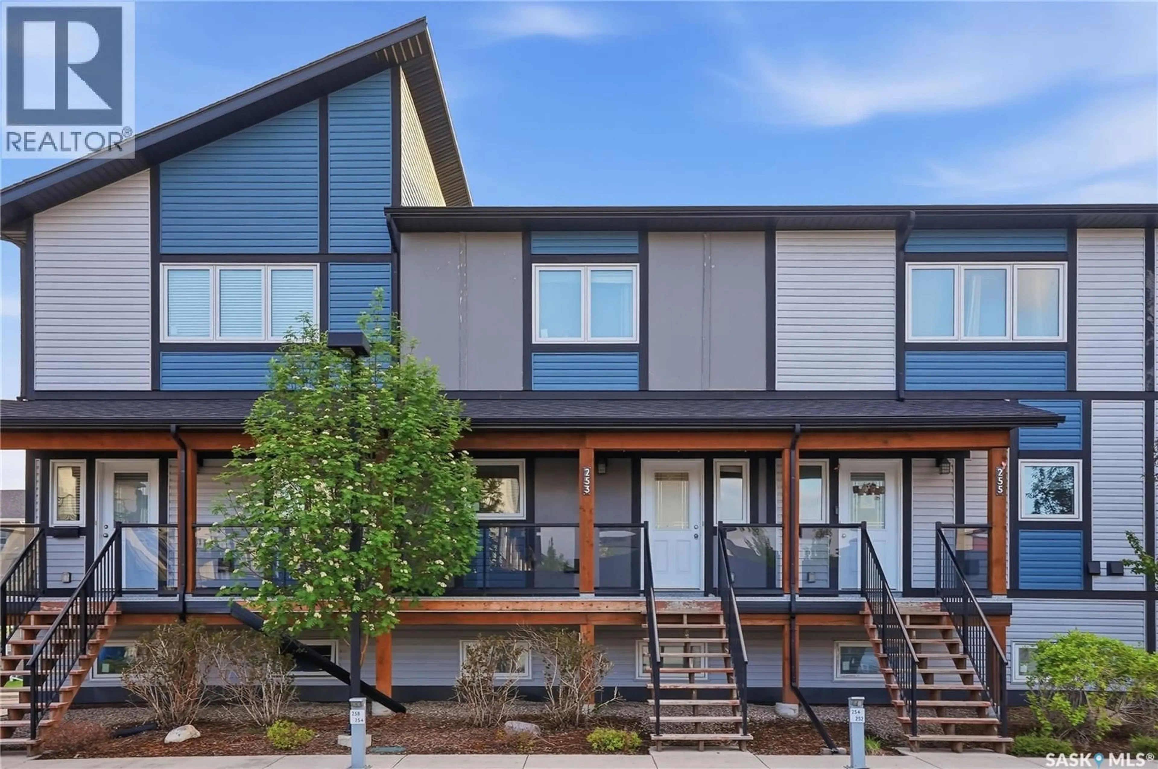Home with vinyl exterior material, street for 250 - 253 AKHTAR BEND, Saskatoon Saskatchewan S7W0W4