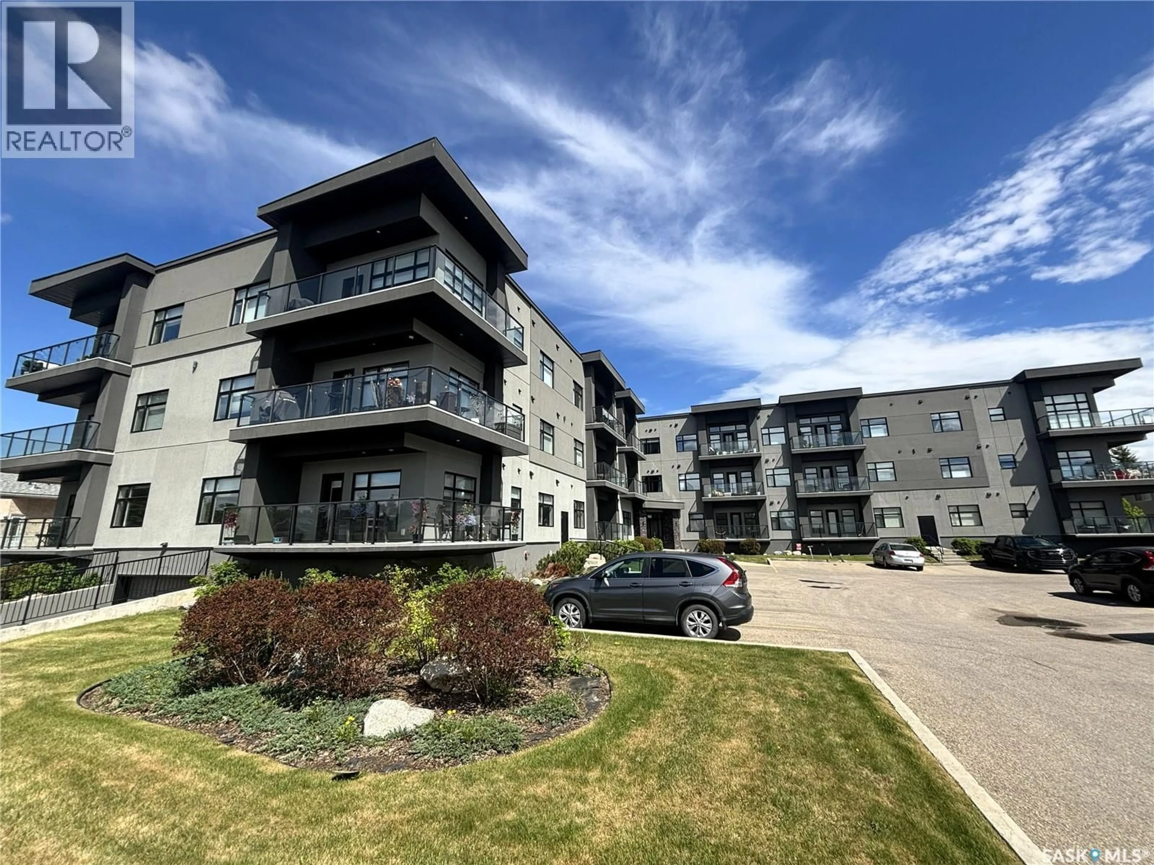 A pic from outside/outdoor area/front of a property/back of a property/a pic from drone, building for 502 - 216-502 PEREHUDOFF CRESCENT, Saskatoon Saskatchewan S7N4H6