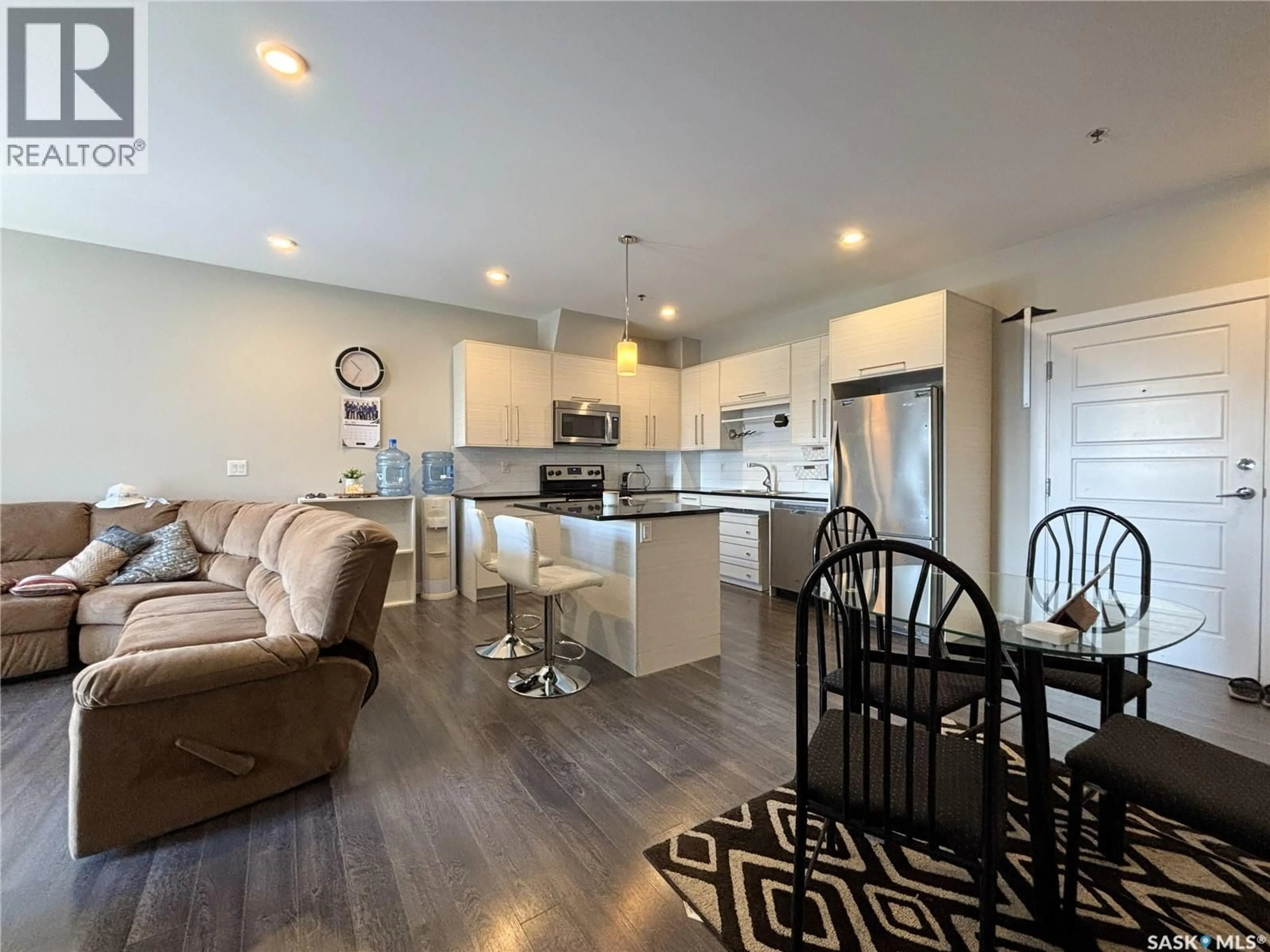 Open concept kitchen, wood/laminate floor for 502 - 216-502 PEREHUDOFF CRESCENT, Saskatoon Saskatchewan S7N4H6