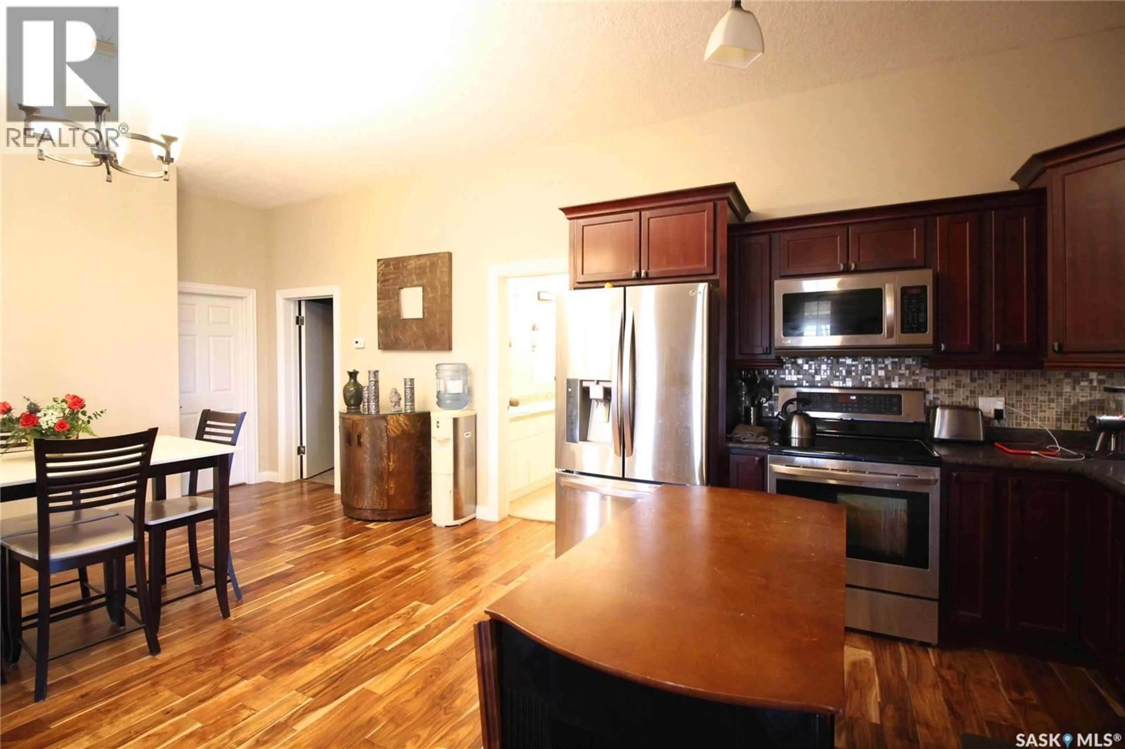 Open concept kitchen, wood/laminate floor for FRANK ACREAGE, Wawken Rm No. 93 Saskatchewan S0G2R0
