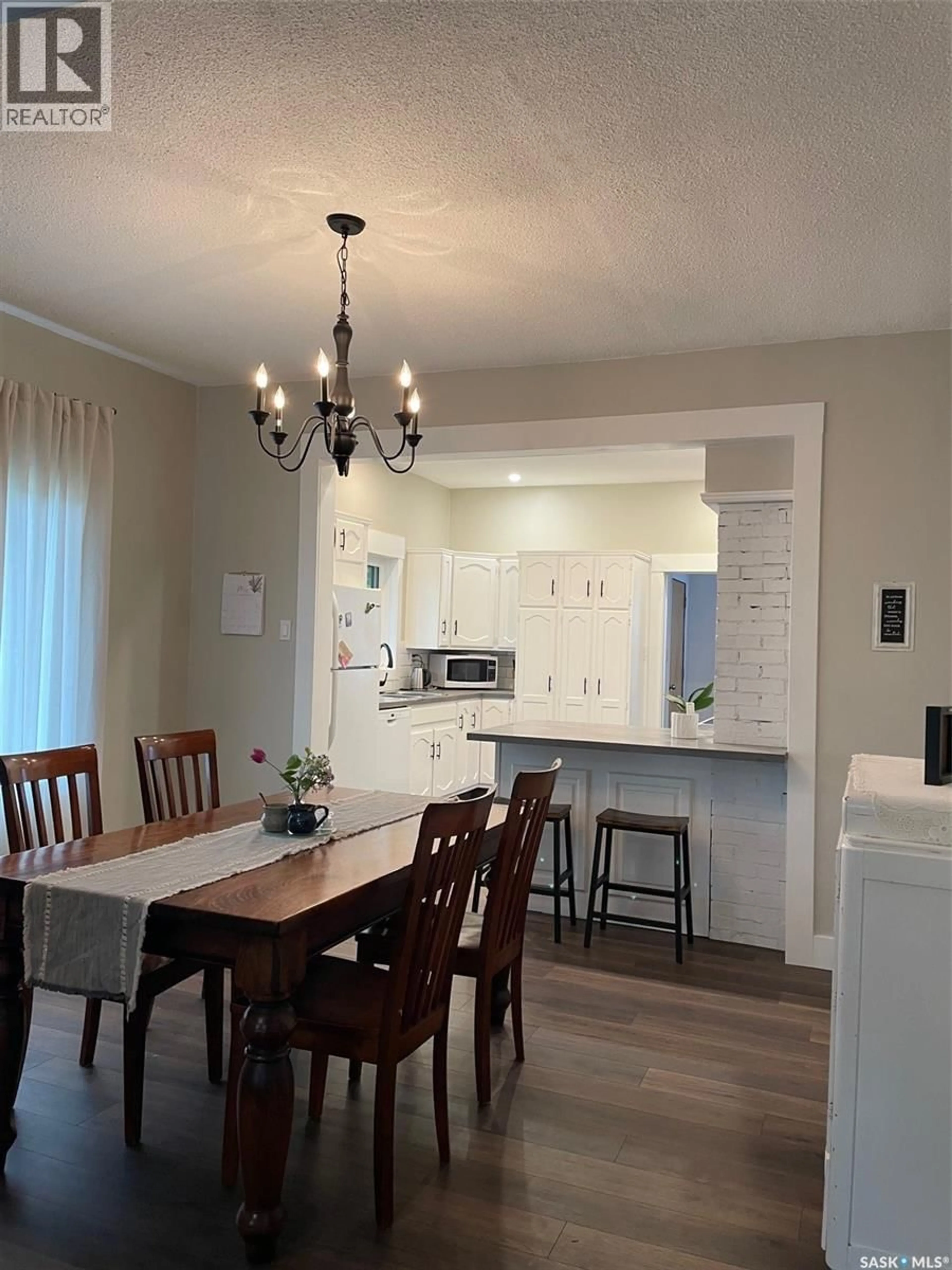 Open concept kitchen, wood/laminate floor for 304 BROWNLEE STREET, Herbert Saskatchewan S0H2A0