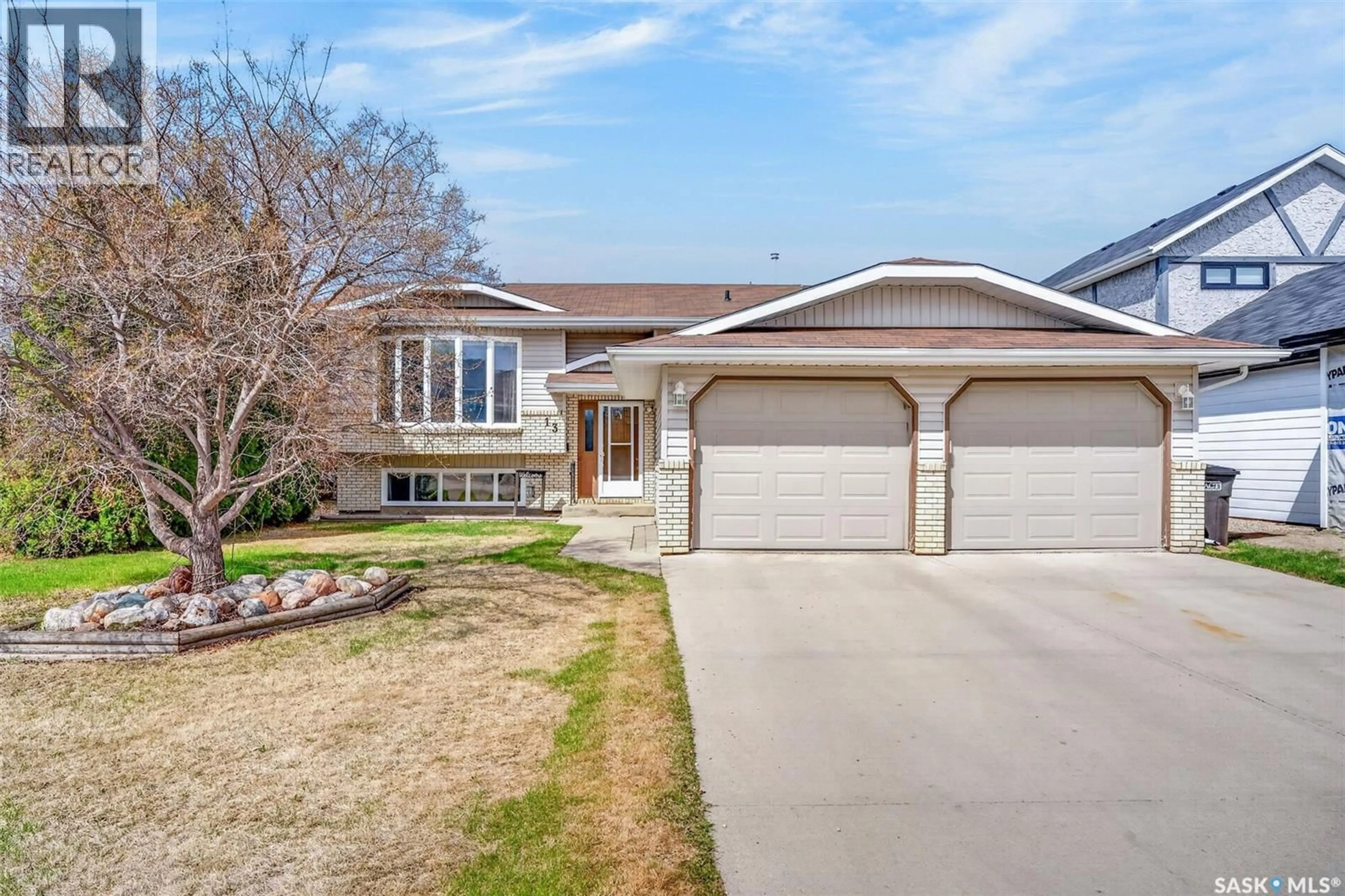 Home with vinyl exterior material, street for 13 DUST CRESCENT, Humboldt Saskatchewan S0K2A0