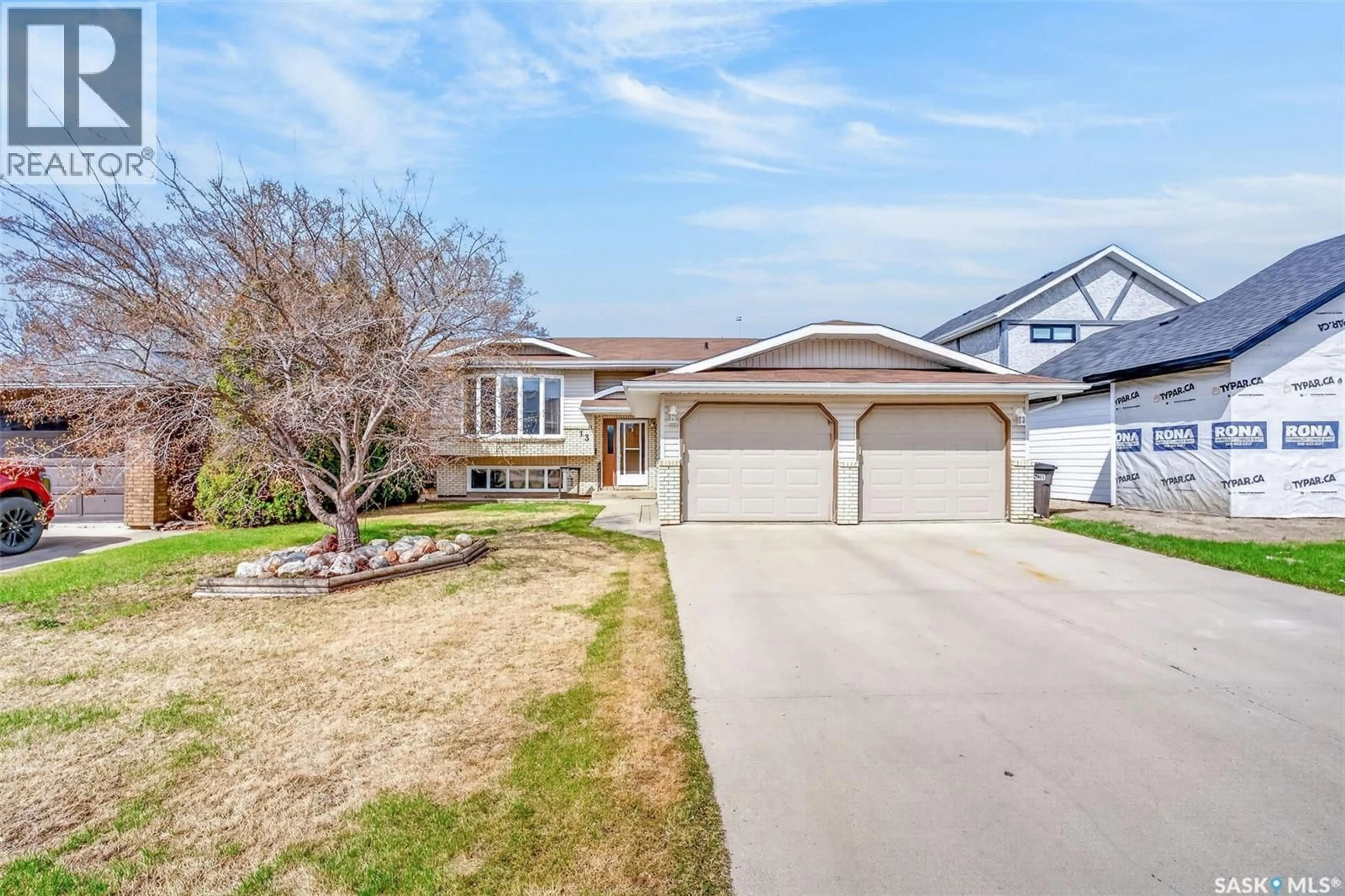Home with vinyl exterior material, street for 13 DUST CRESCENT, Humboldt Saskatchewan S0K2A0
