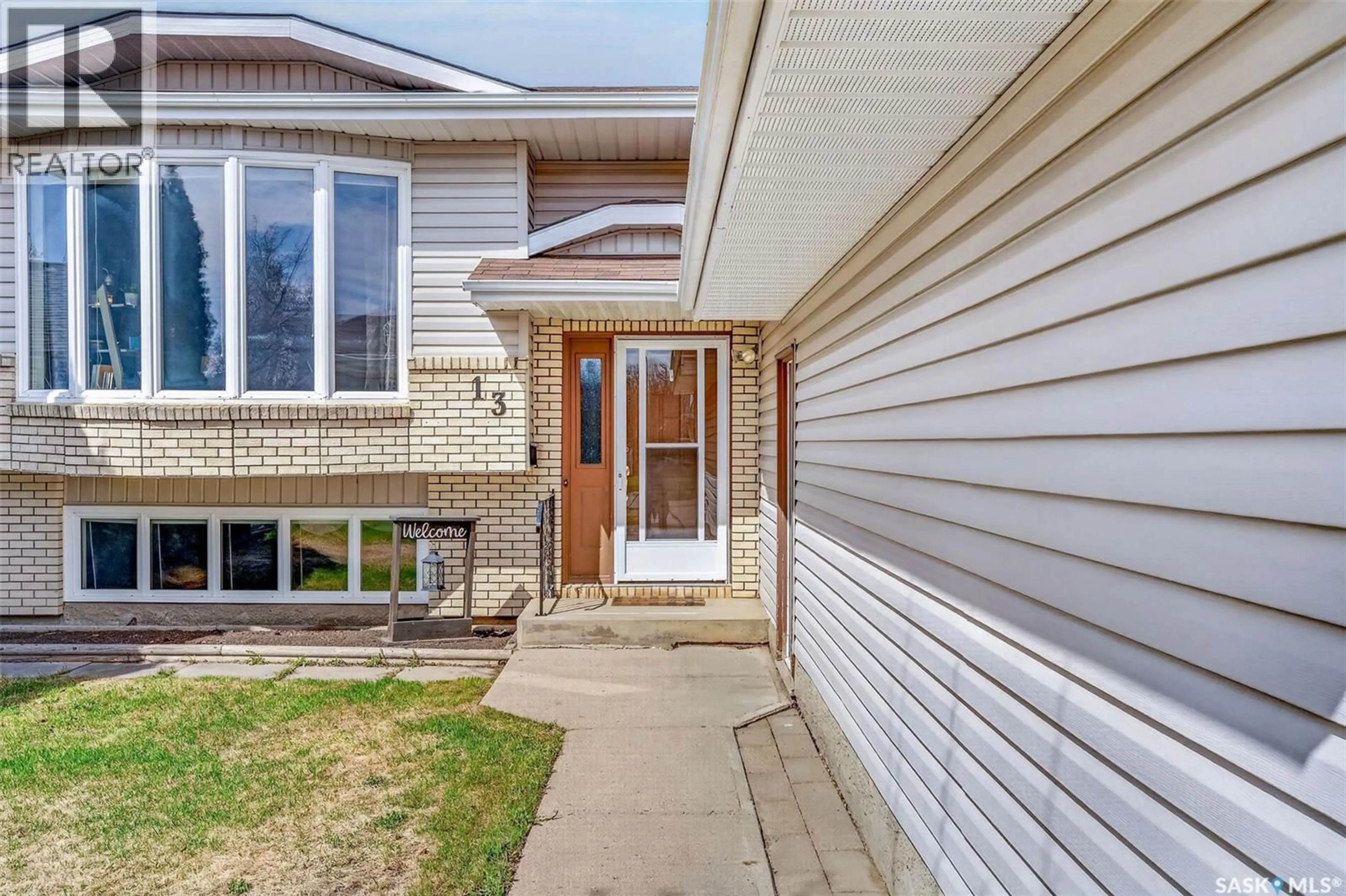 Home with vinyl exterior material, street for 13 DUST CRESCENT, Humboldt Saskatchewan S0K2A0