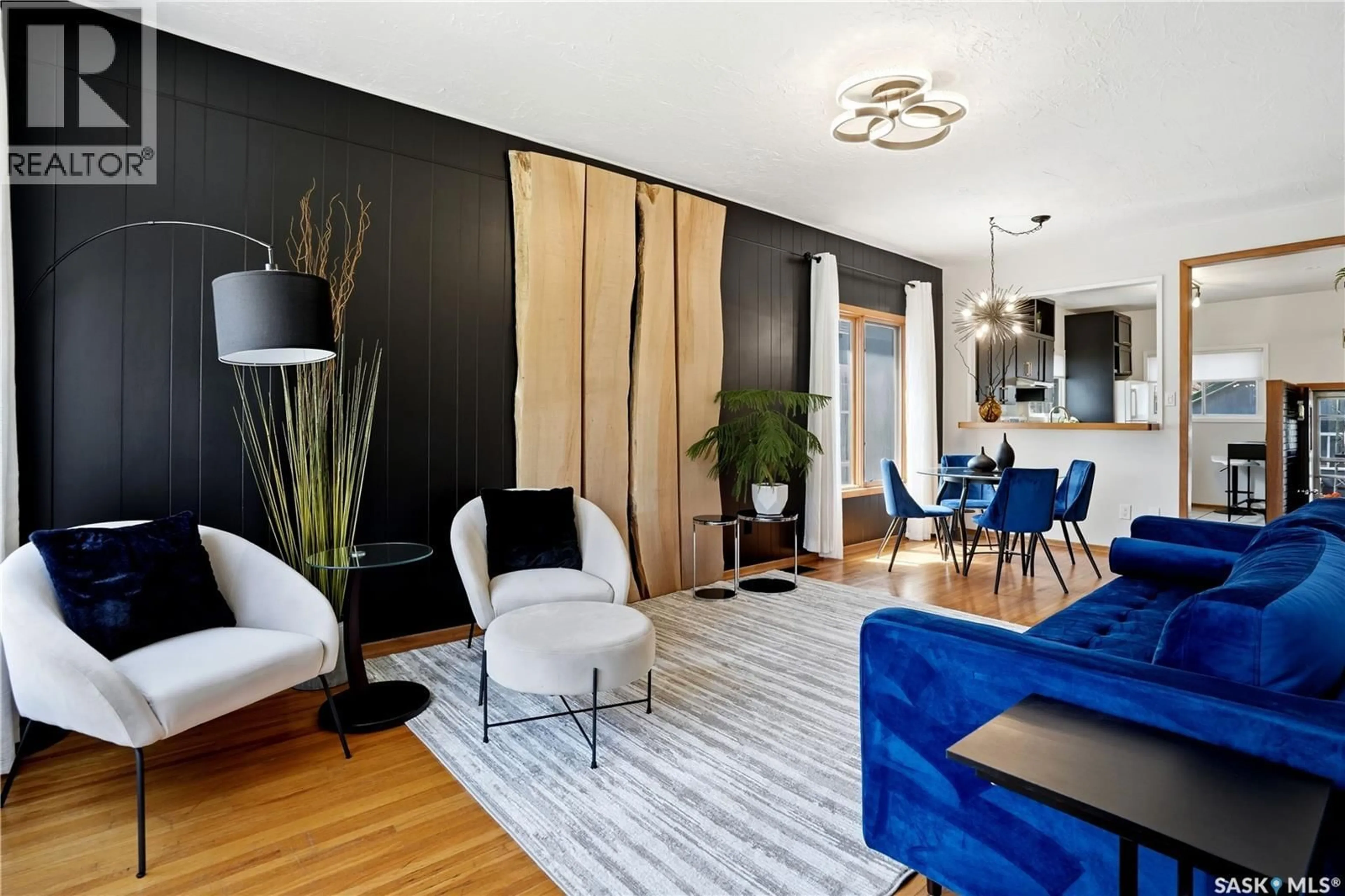 Living room with furniture, wood/laminate floor for 3136 ROBINSON STREET, Regina Saskatchewan S4S1V5