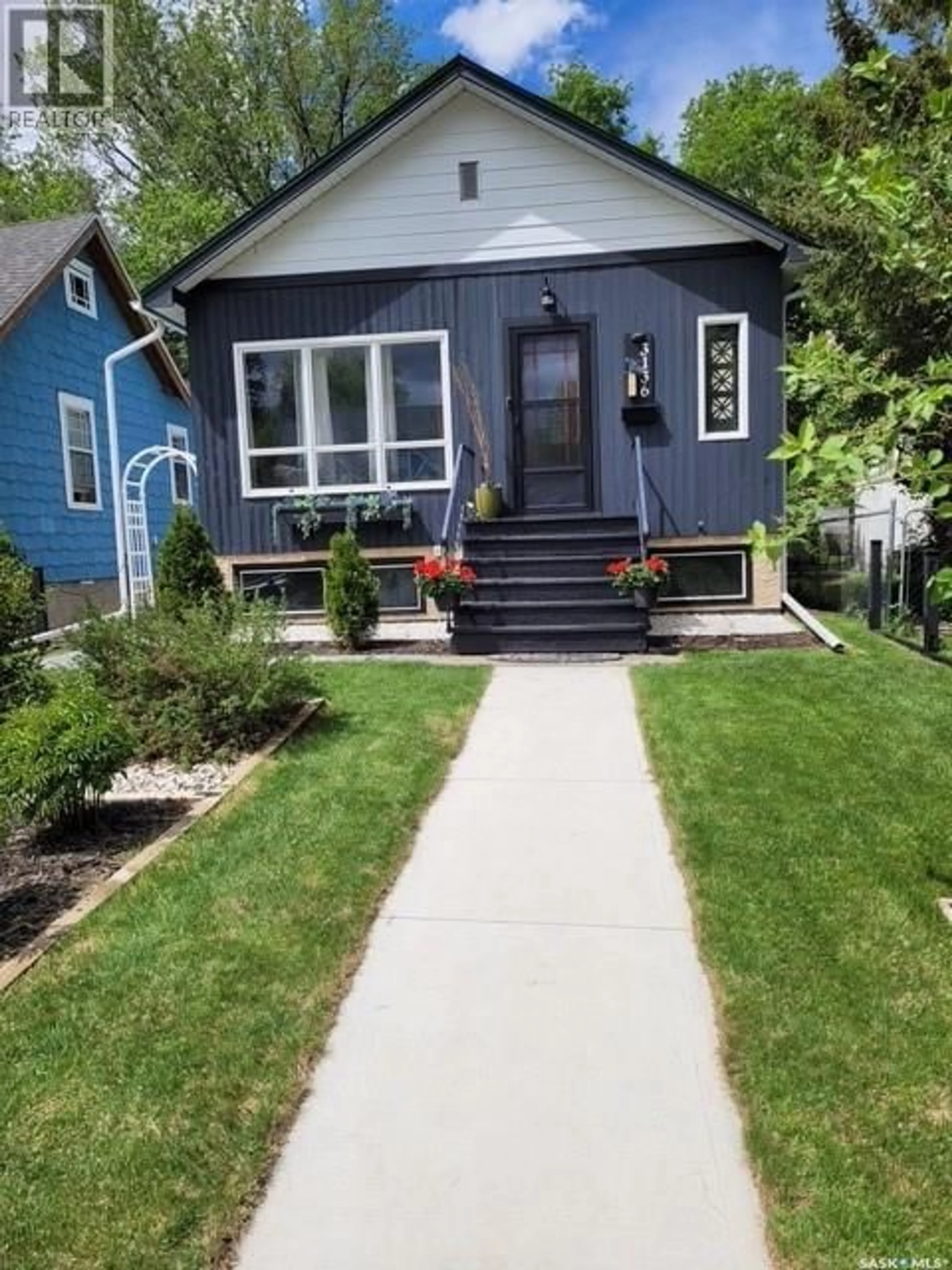 Home with vinyl exterior material, street for 3136 ROBINSON STREET, Regina Saskatchewan S4S1V5