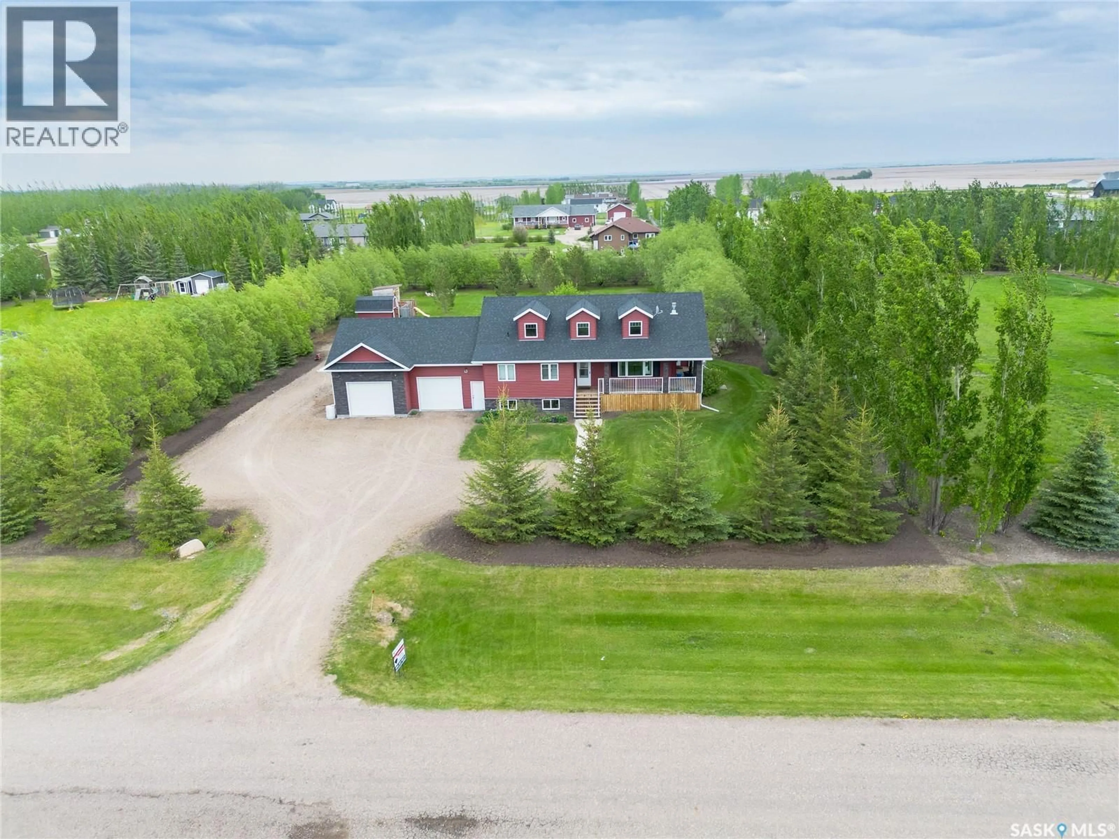A pic from outside/outdoor area/front of a property/back of a property/a pic from drone, unknown for 21 HERITAGE DRIVE, Rosthern Rm No. 403 Saskatchewan S0K1X1