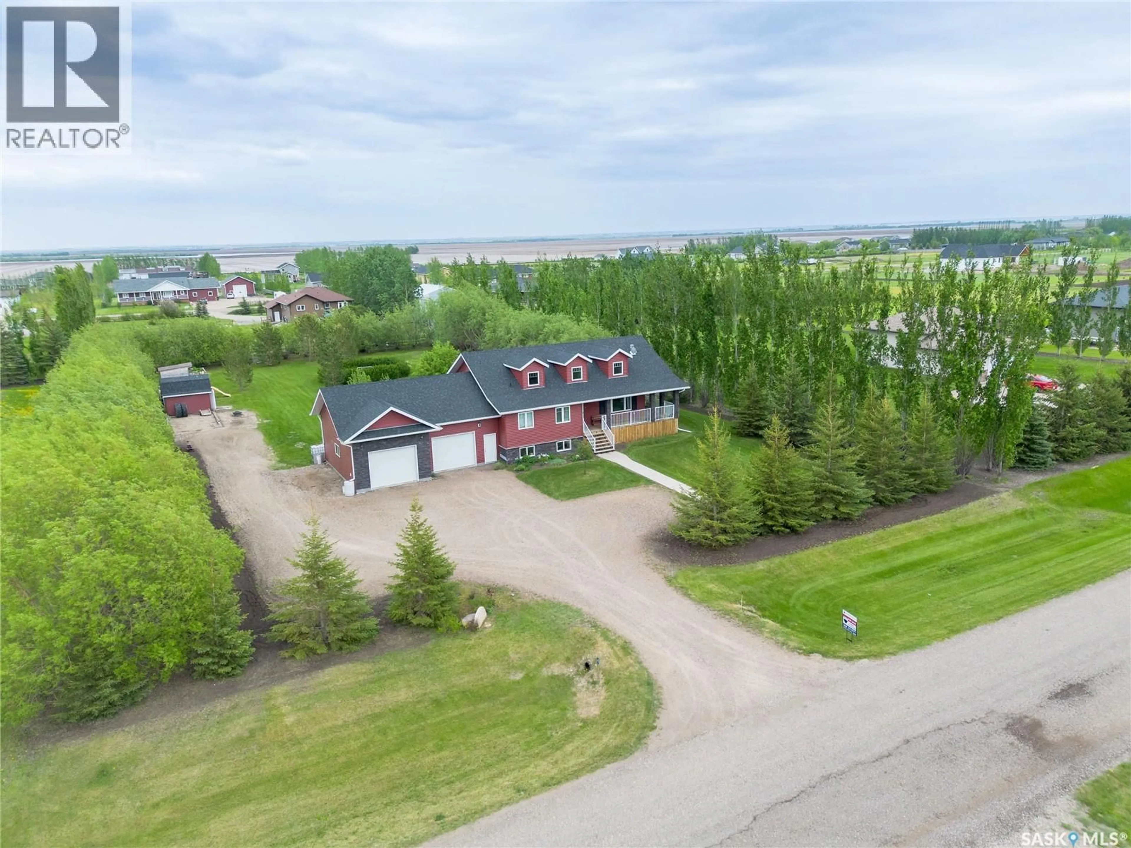A pic from outside/outdoor area/front of a property/back of a property/a pic from drone, water/lake/river/ocean view for 21 HERITAGE DRIVE, Rosthern Rm No. 403 Saskatchewan S0K1X1