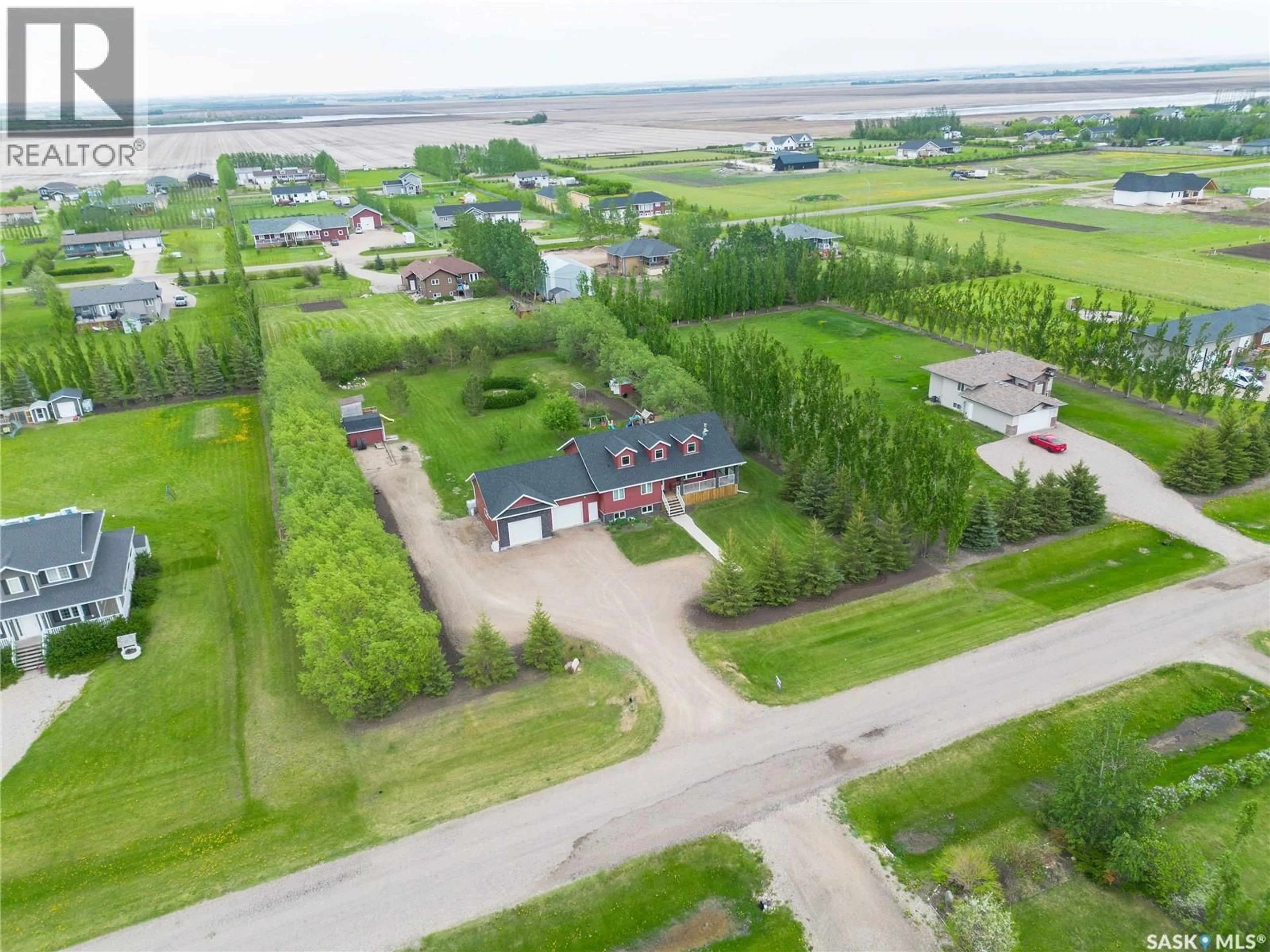 A pic from outside/outdoor area/front of a property/back of a property/a pic from drone, street for 21 HERITAGE DRIVE, Rosthern Rm No. 403 Saskatchewan S0K1X1