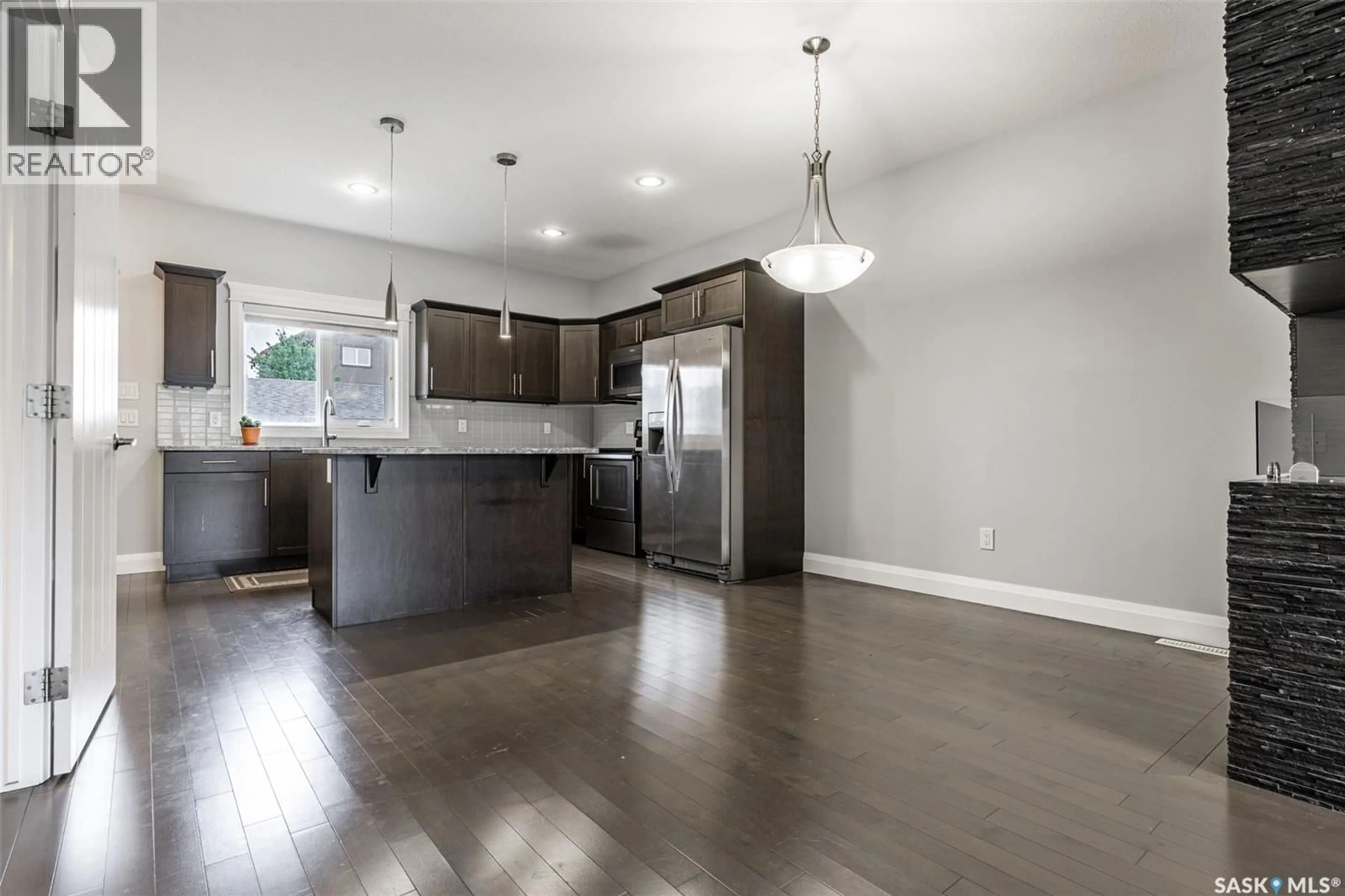Open concept kitchen, wood/laminate floor for N - 18 111 ROSEWOOD GATE, Saskatoon Saskatchewan S7V0E5
