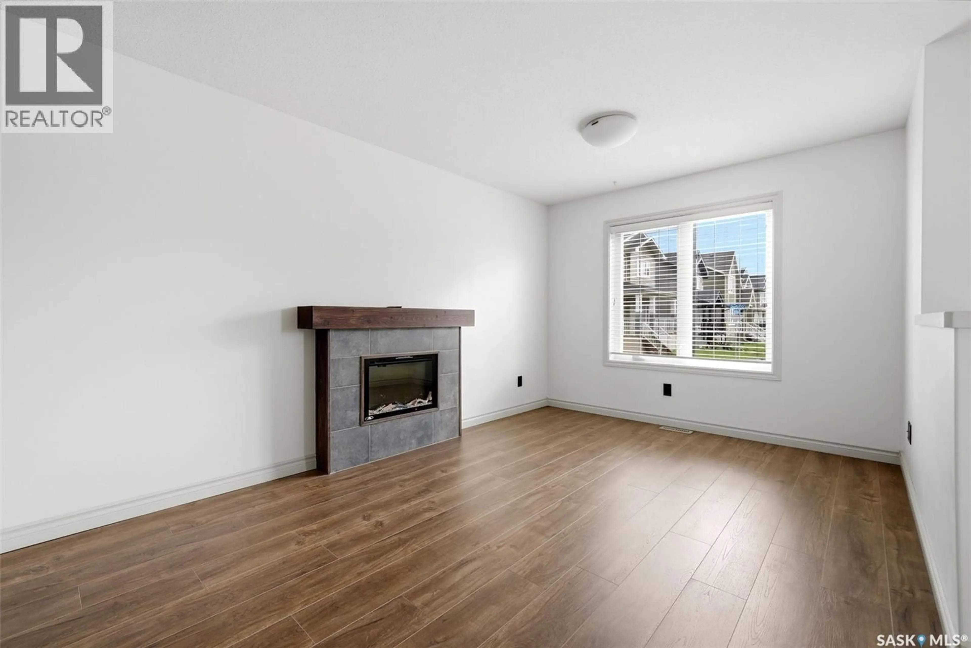 Living room with furniture, wood/laminate floor for 4348 SHAFFER STREET, Regina Saskatchewan S4W0L4